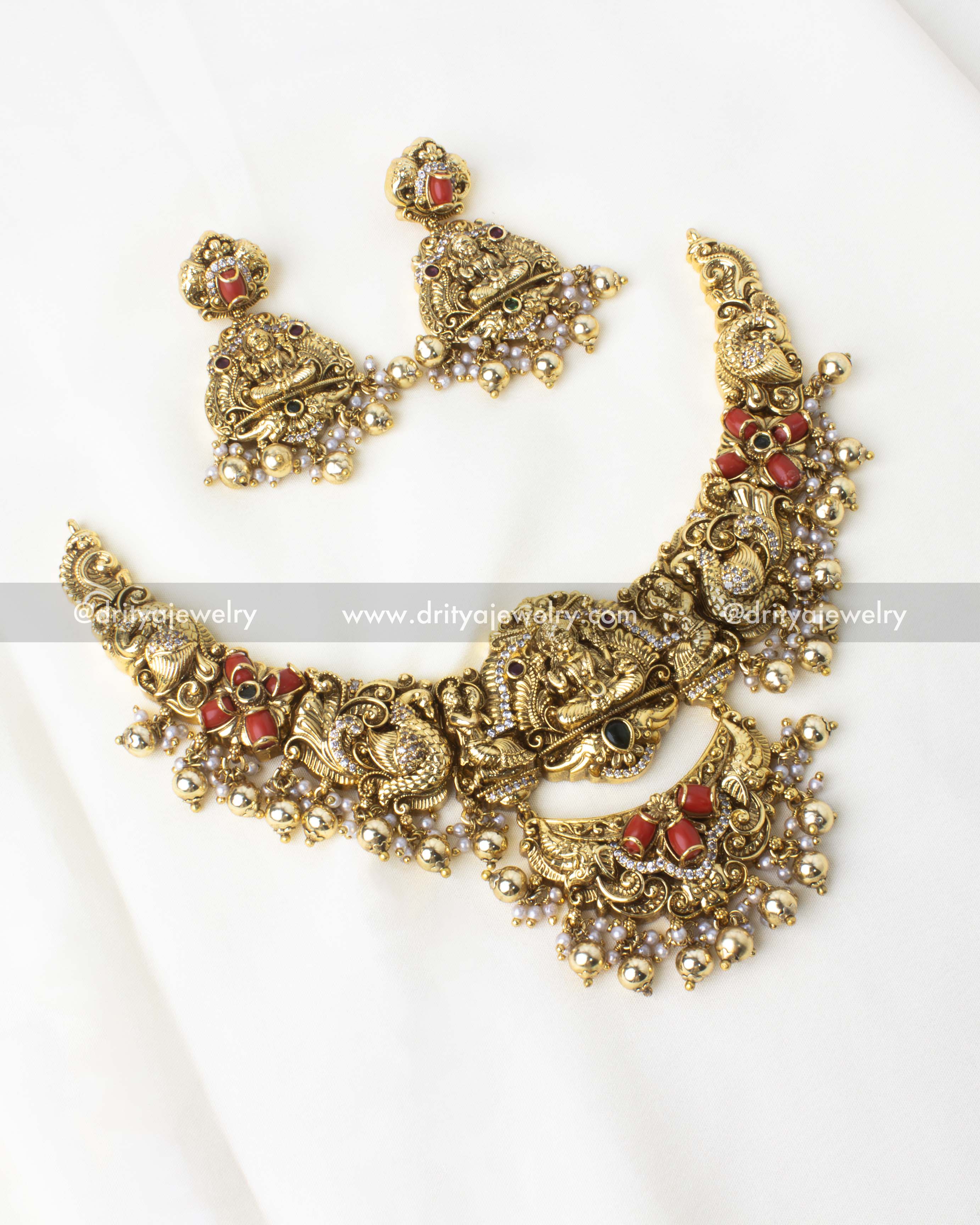 Nakshi-style short necklace with intricate detailing and coral bead embellishments.