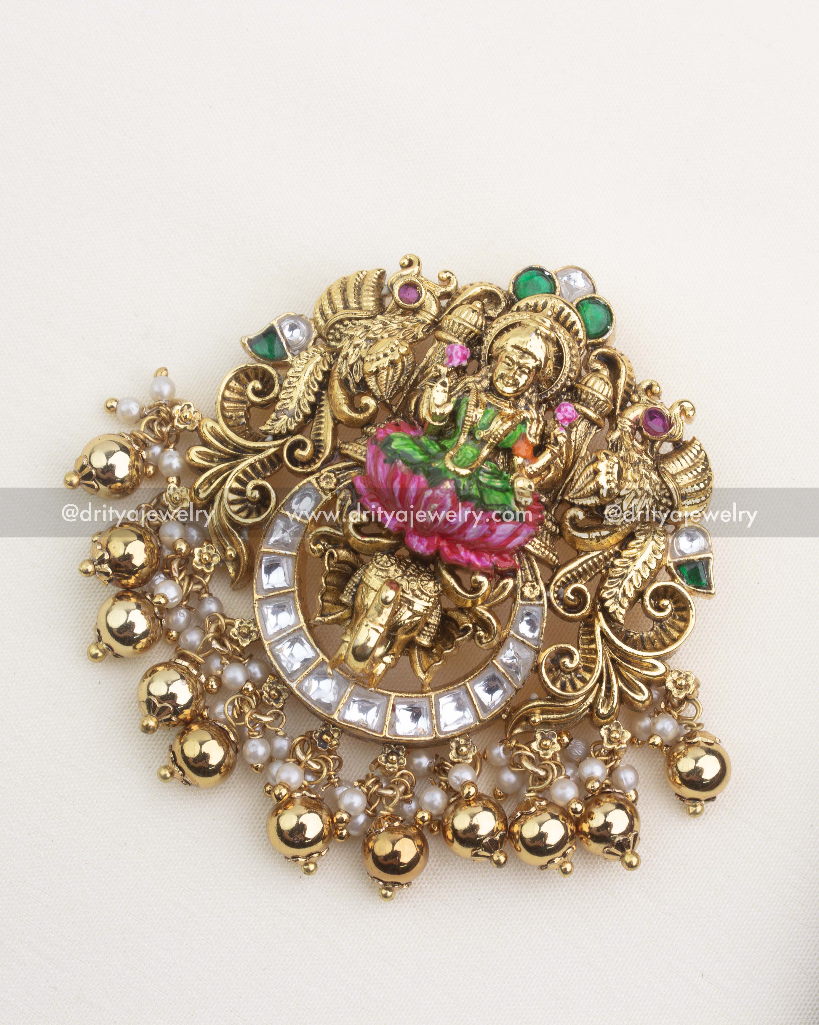Premium nakshi temple pendant featuring meenakari Lakshmi, kemp stones, kundan detailing, and pearl-gold danglers.