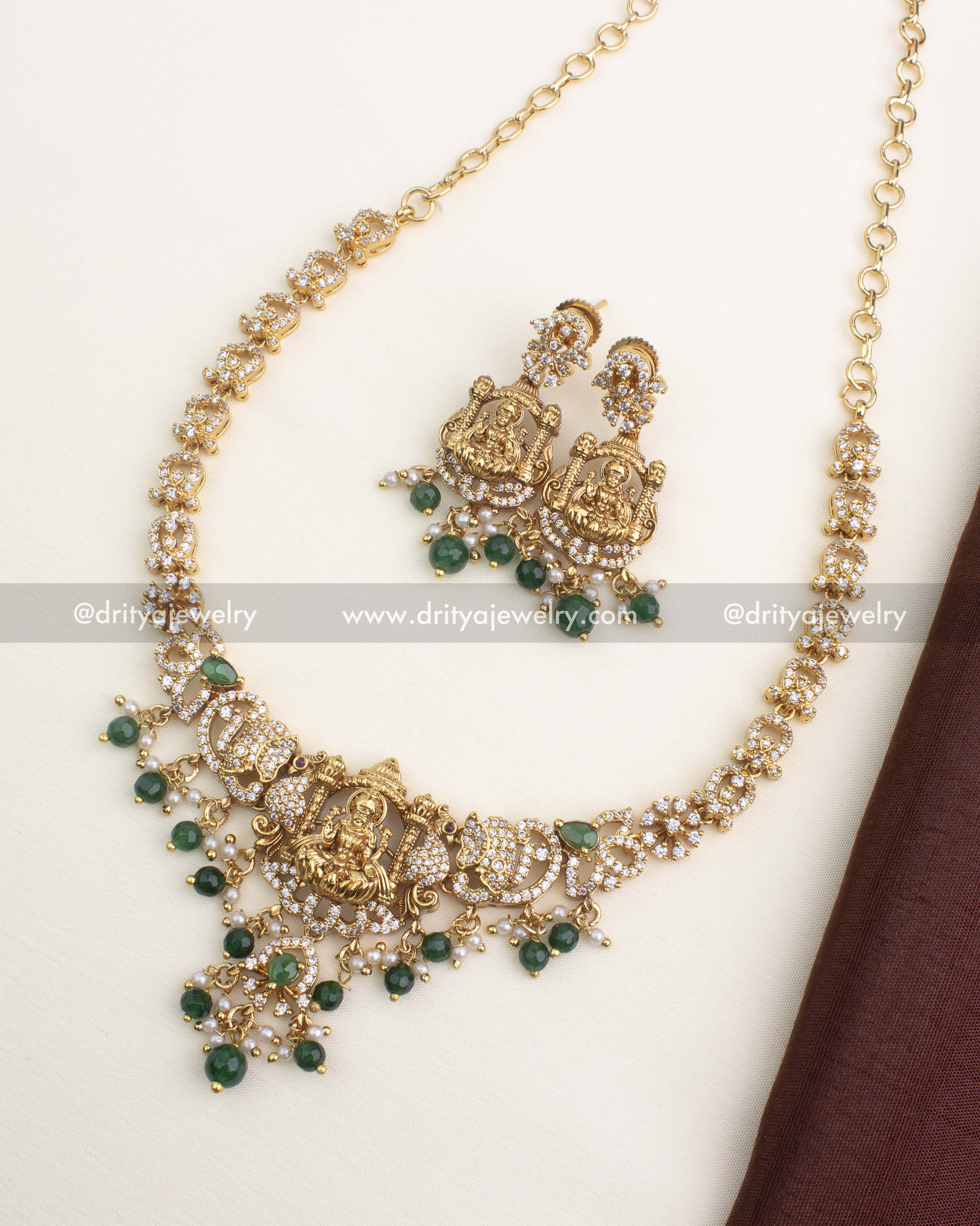 Premium Nakshi Temple Short Necklace with Lakshmi pendant, green beads, CZ stones and matching earrings.
