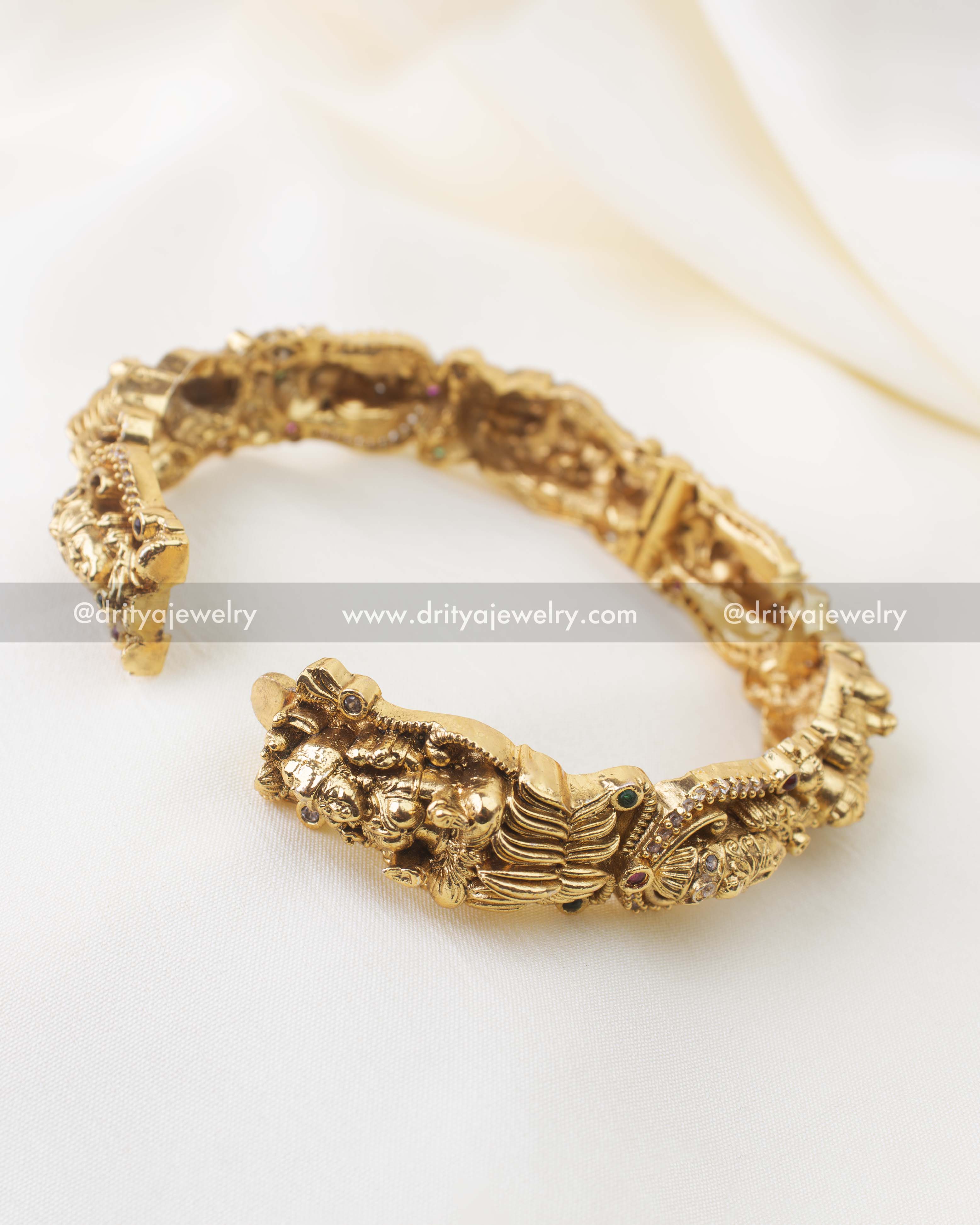 Openable antique gold nakshi bangles with intricate Lakshmi Narayana carvings