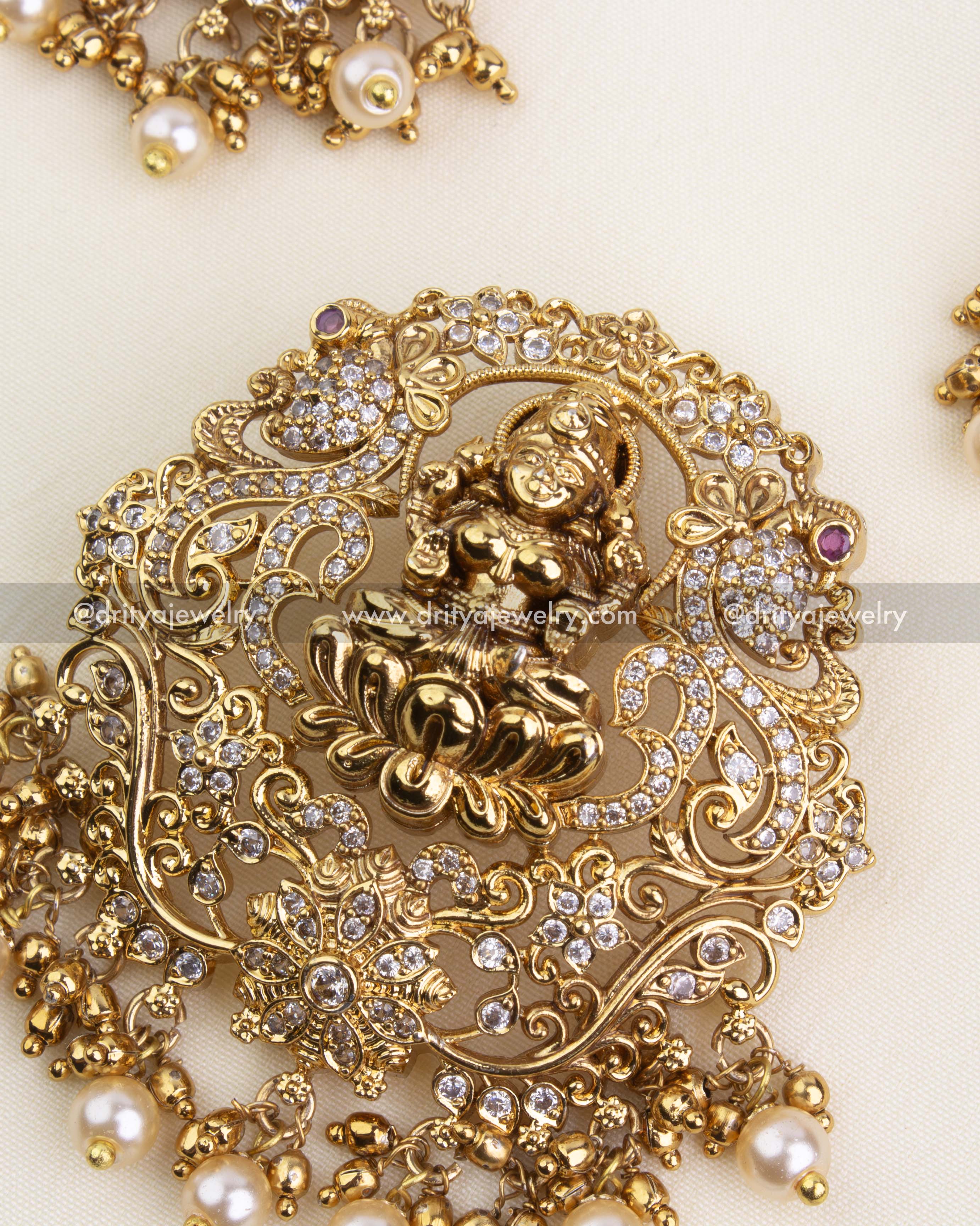 Zoom-in of intricate nakshi and diamond-like stones on pendant