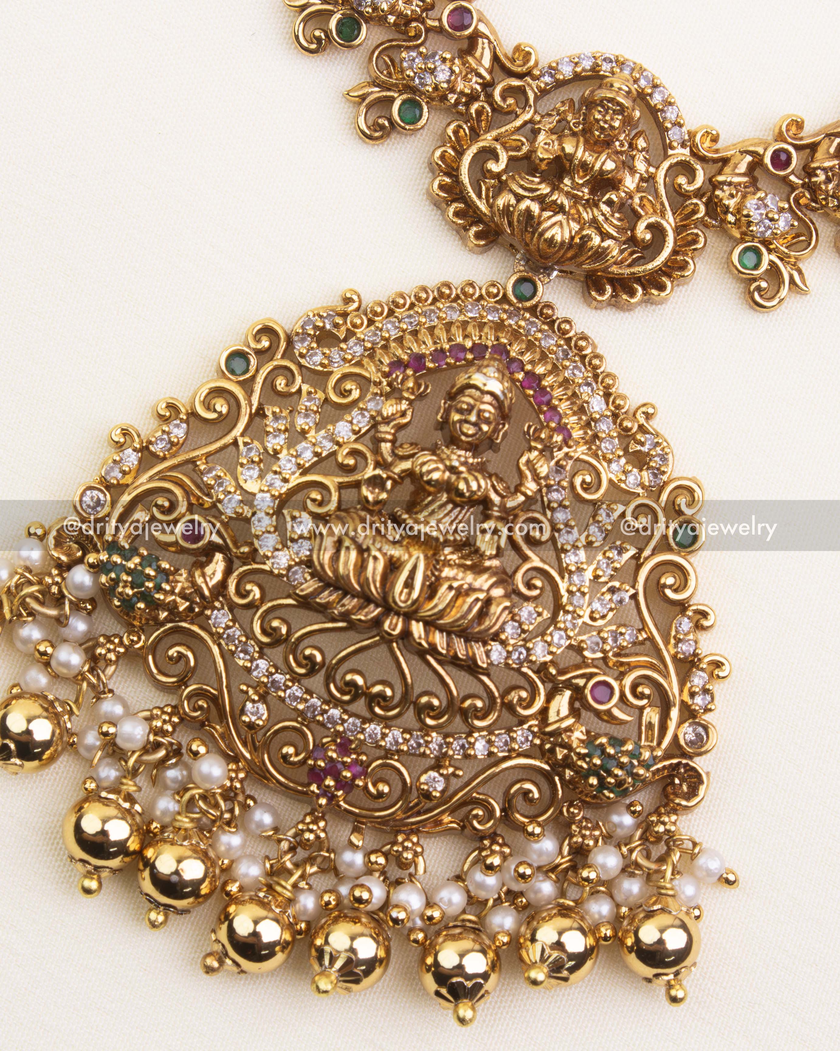 Intricate goddess pendant with CZ stones, pearl drops, and antique gold polish