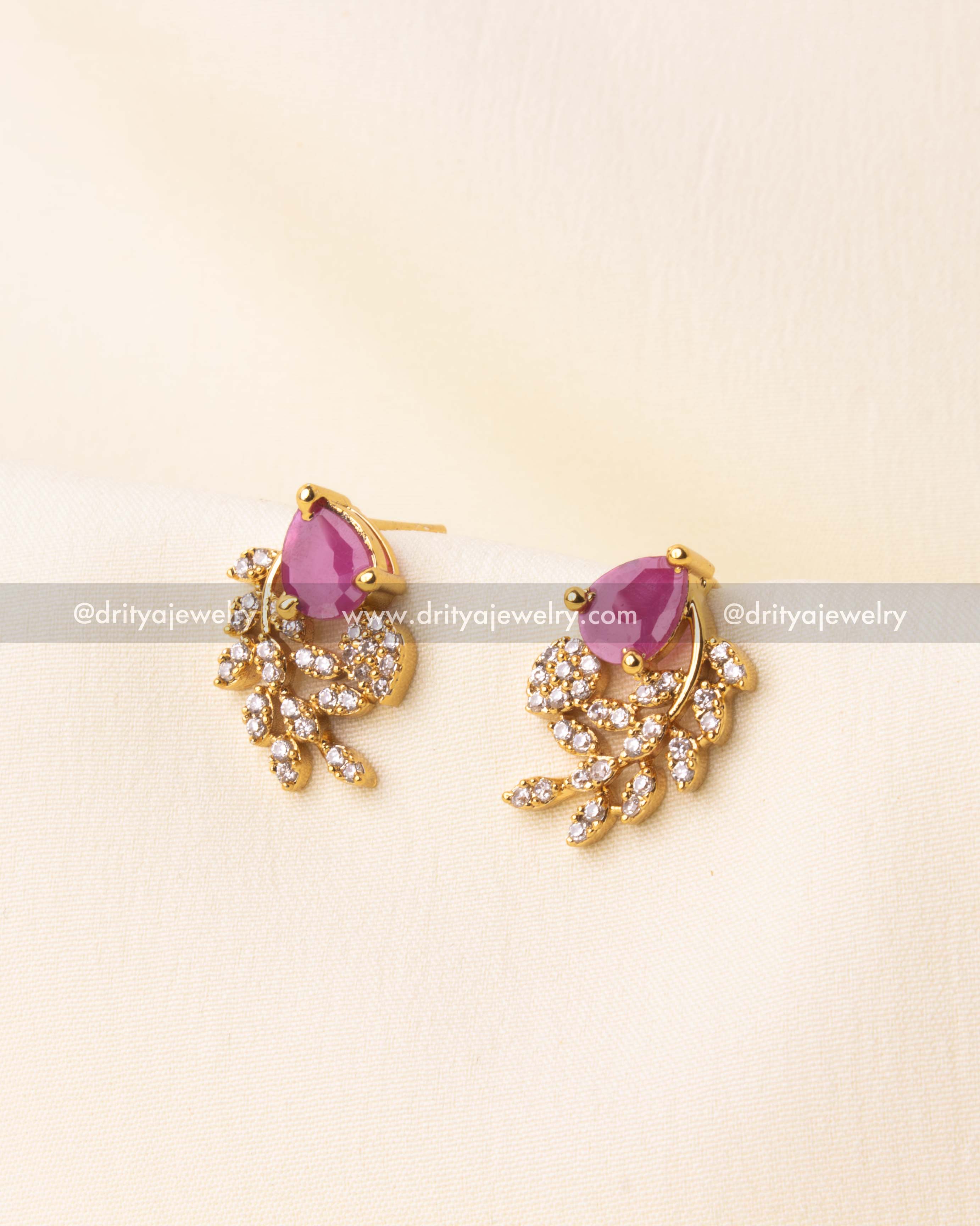 Gold-plated earrings with pink center stones and crystal accents.