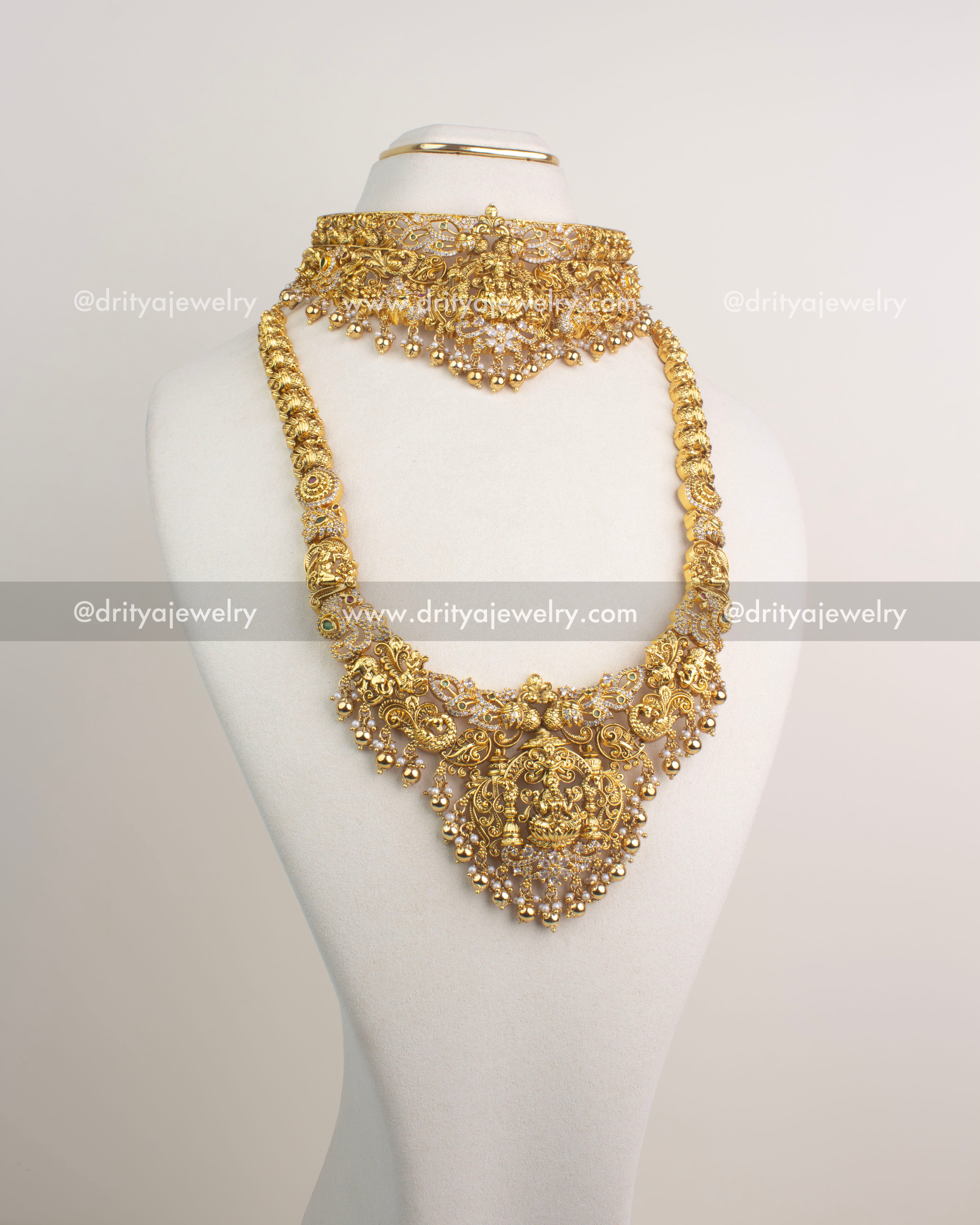 Antique gold combo set with choker, long necklace, and jhumka earrings featuring Lakshmi Devi motifs.