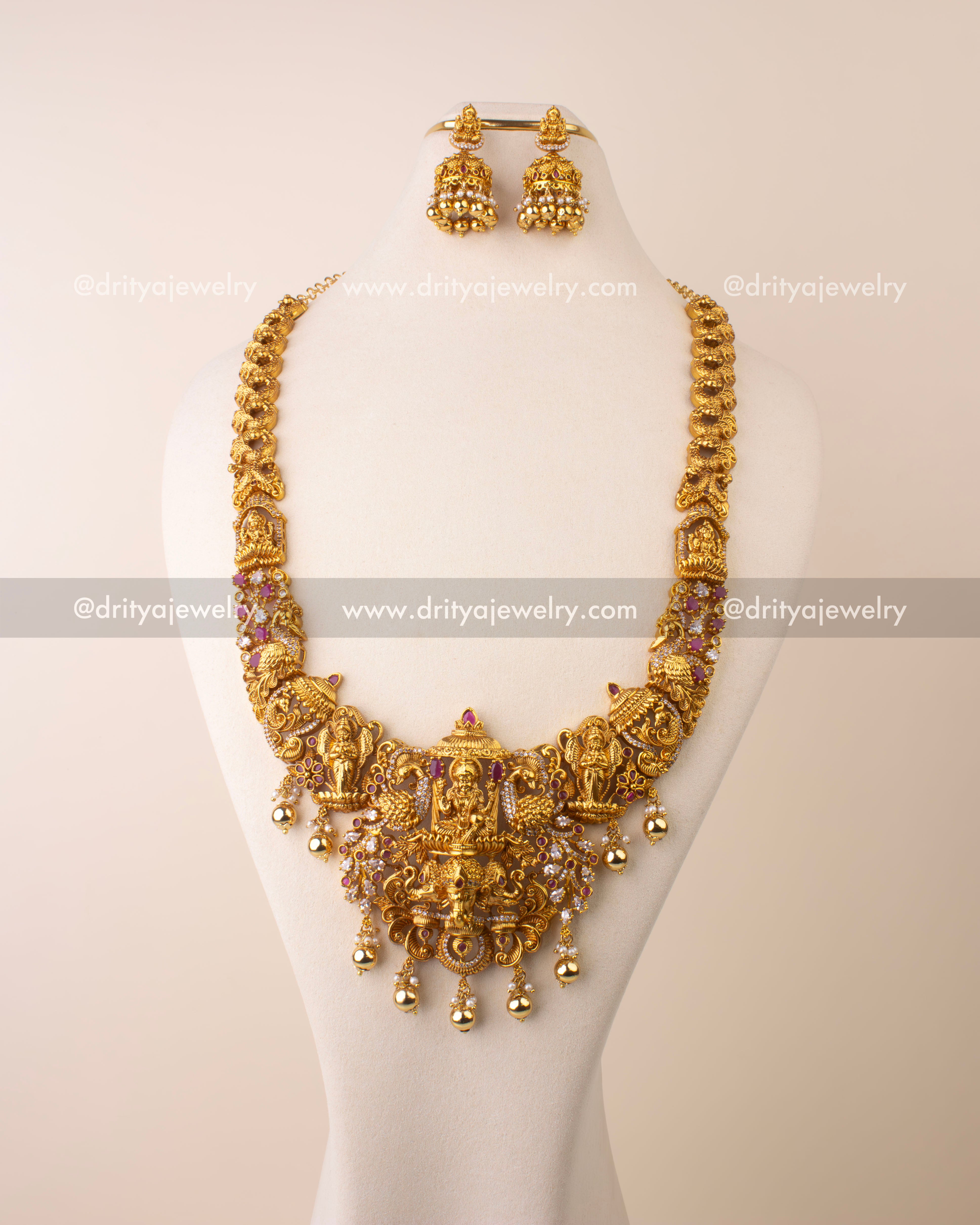 Antique gold replica temple necklace featuring Goddess Lakshmi pendant with Kemp and CZ stone detailing.