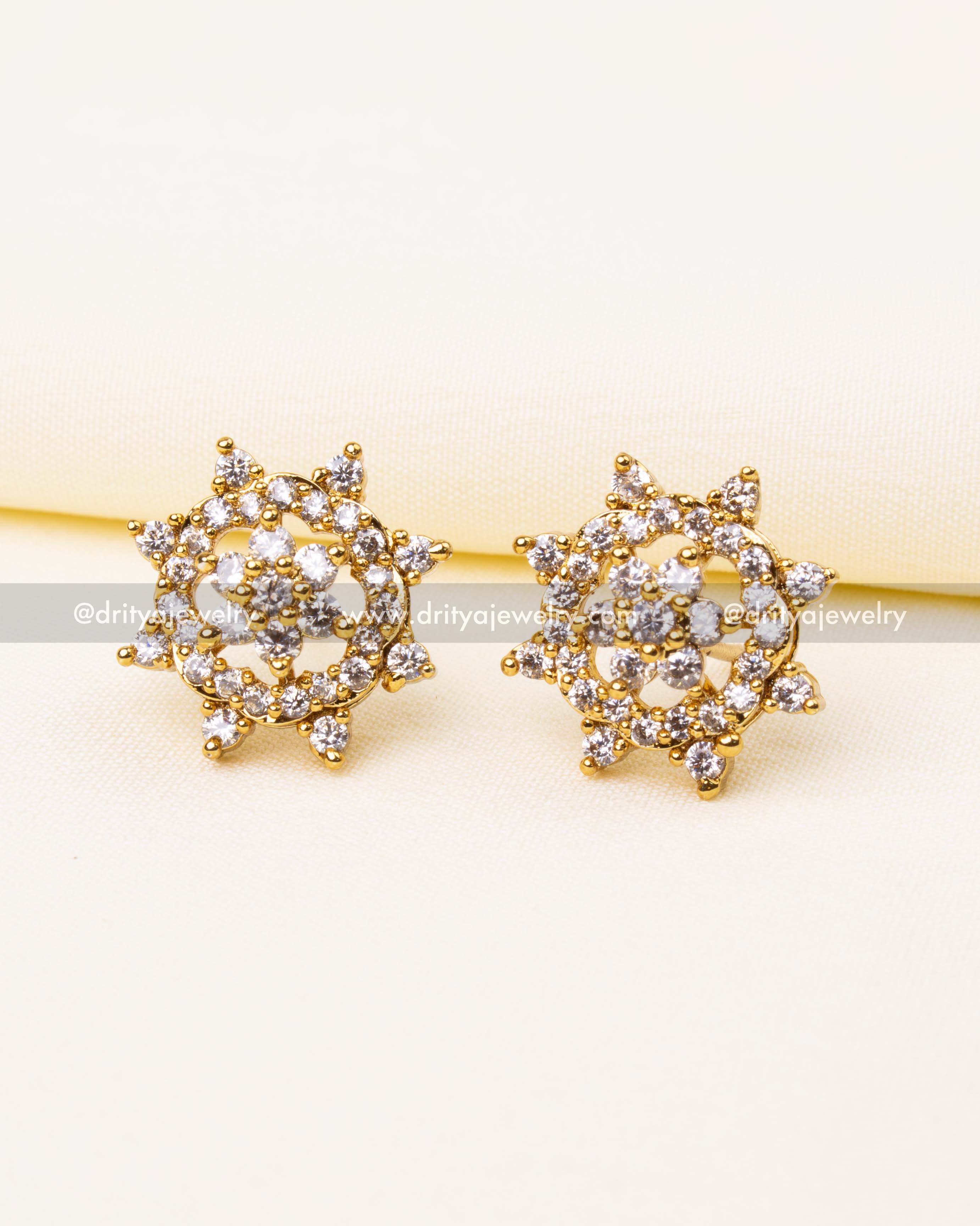 Round gold-finished stud earrings with sparkling CZ cluster design.