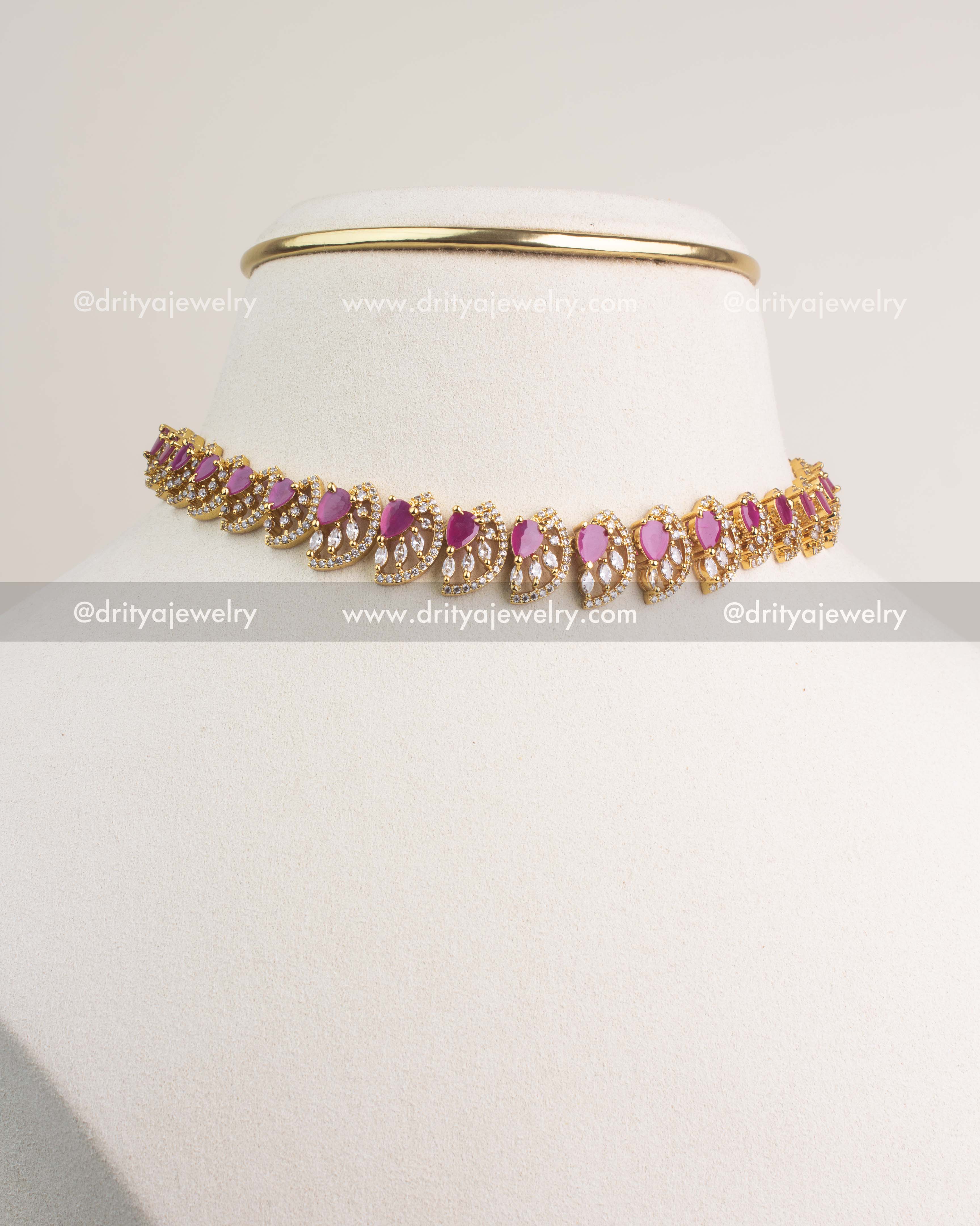 Ruby CZ short necklace set with gold polish and matching earrings.