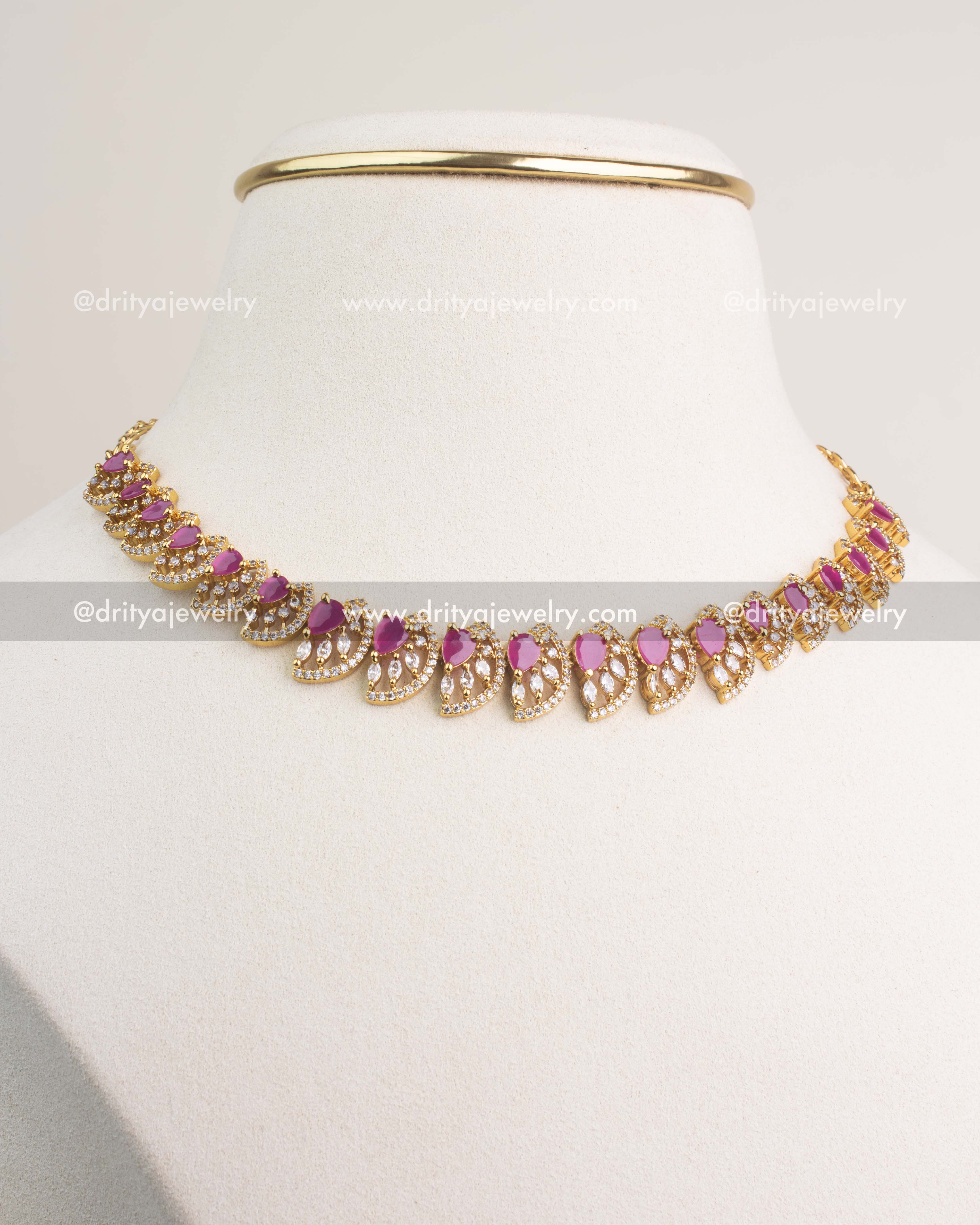 Ruby CZ short necklace set with gold polish and matching earrings.