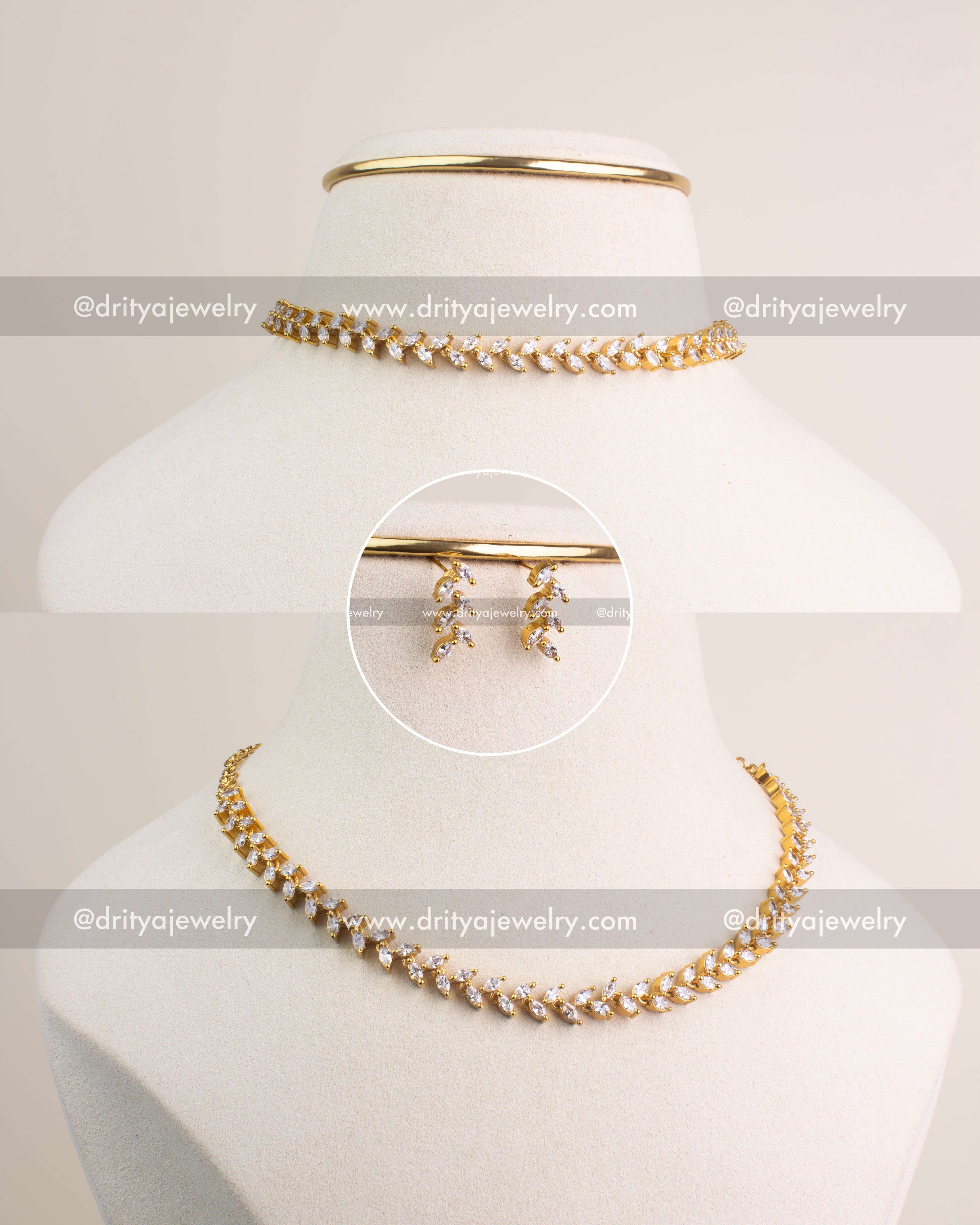 Gold-plated climber necklace set with marquise-cut CZ stones and matching earrings.