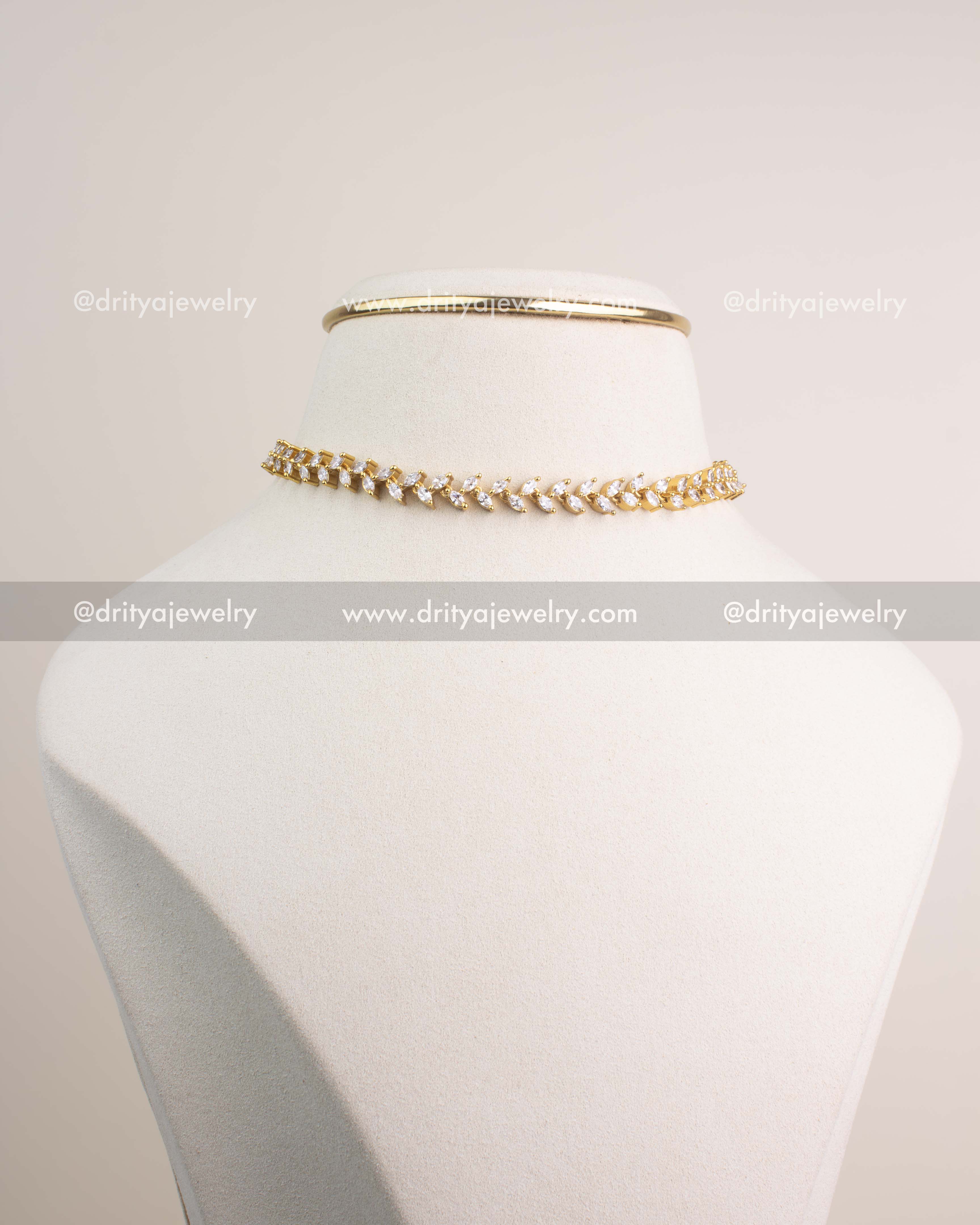 Premium gold climber necklace and matching CZ climber earrings displayed together.