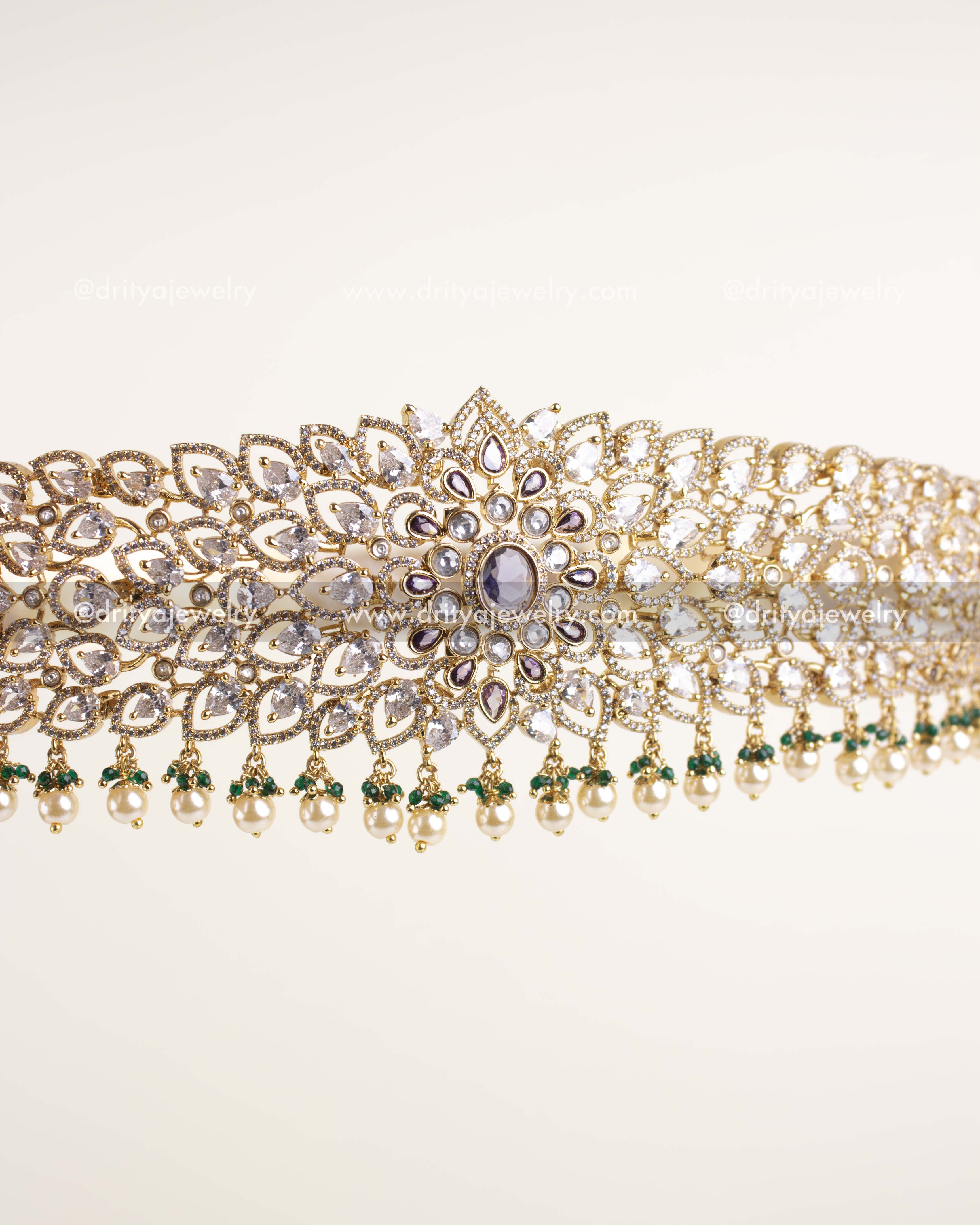 Intricate lattice pattern waist belt featuring diamond replica stones and lavender centerpiece.