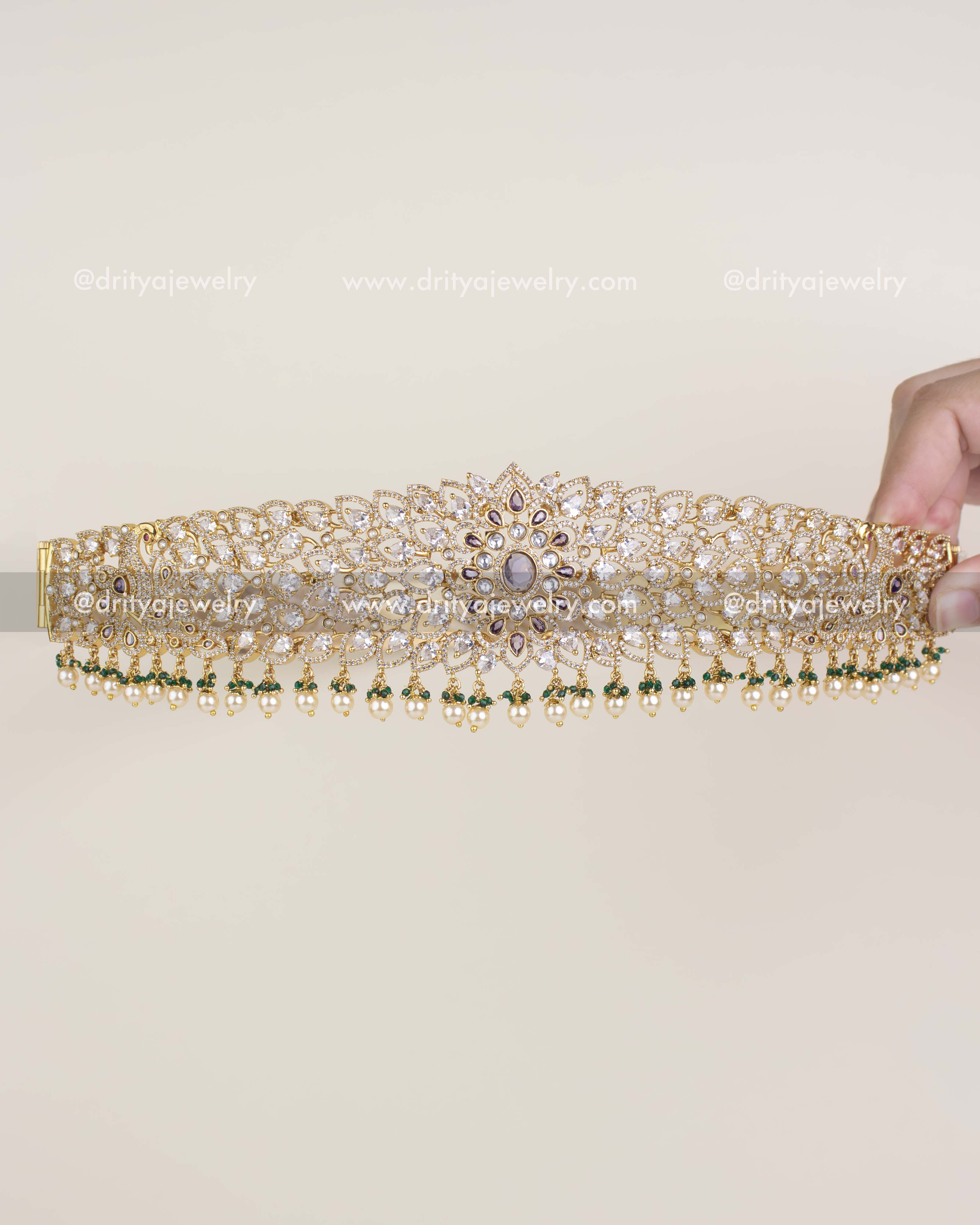 Diamond replica bridal waist belt with floral CZ design and pearl-green bead hangings.