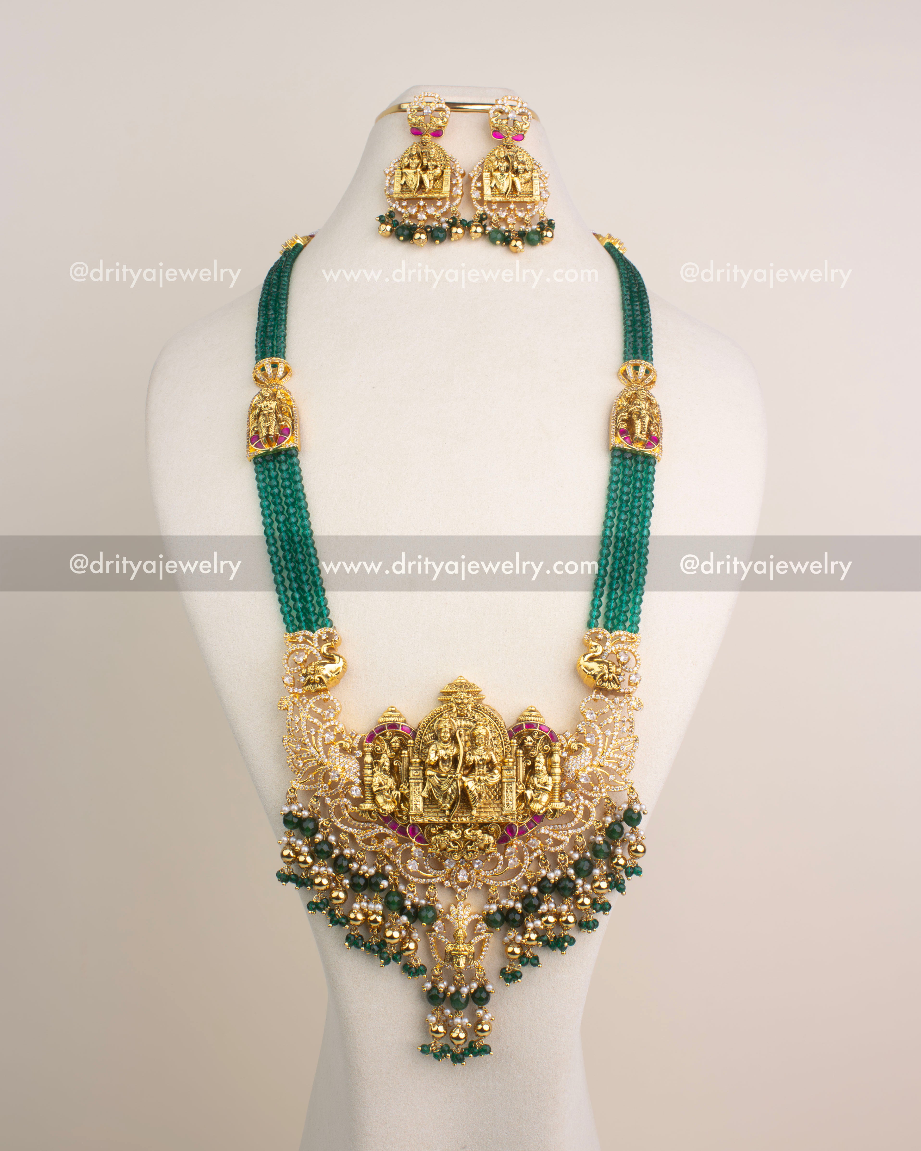 Antique gold Nakshi long necklace with Ram Parivar motif, green beads, and Kemp stones.