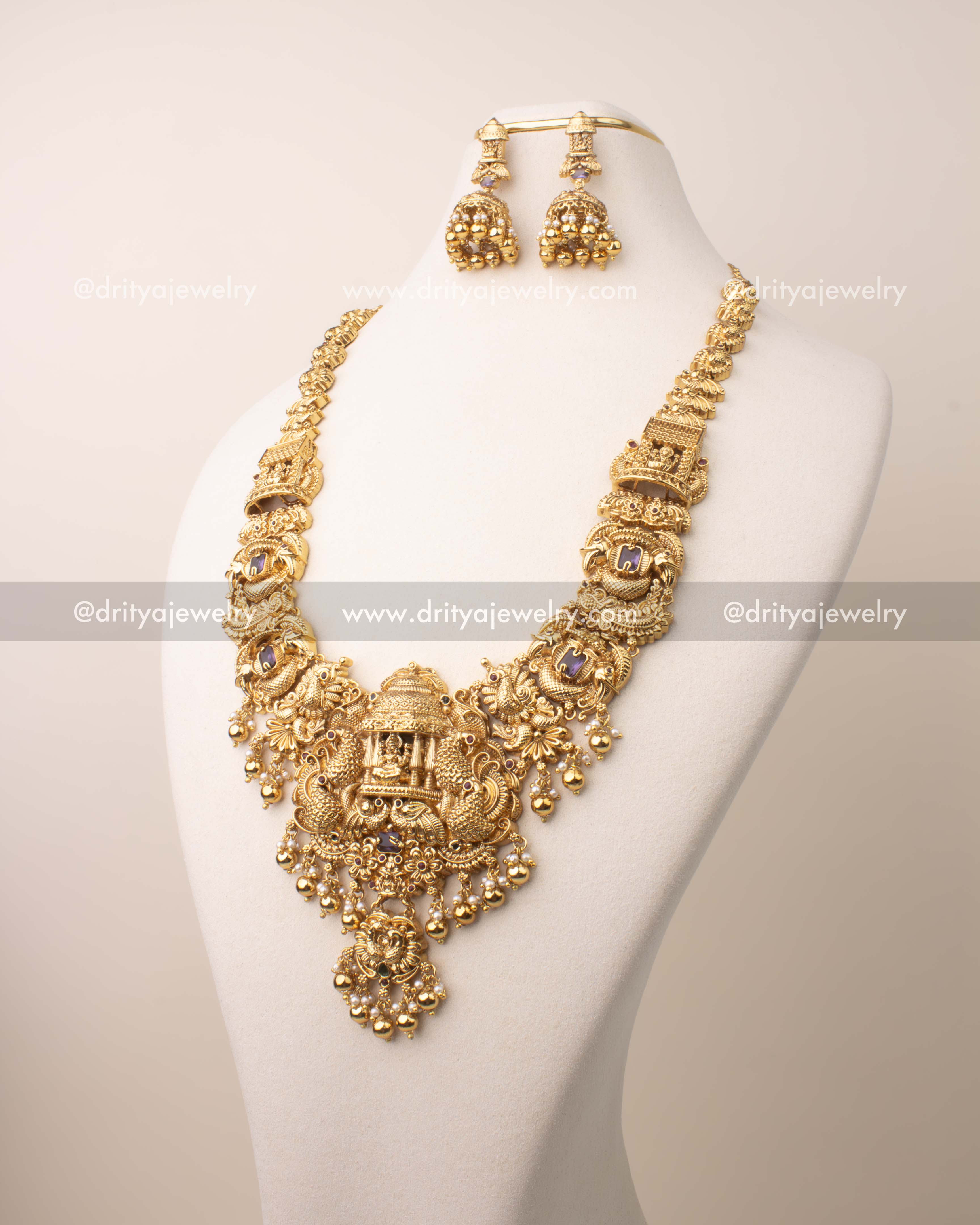 Temple jewelry long necklace set featuring a goddess Lakshmi pendant with detailed nakshi design.