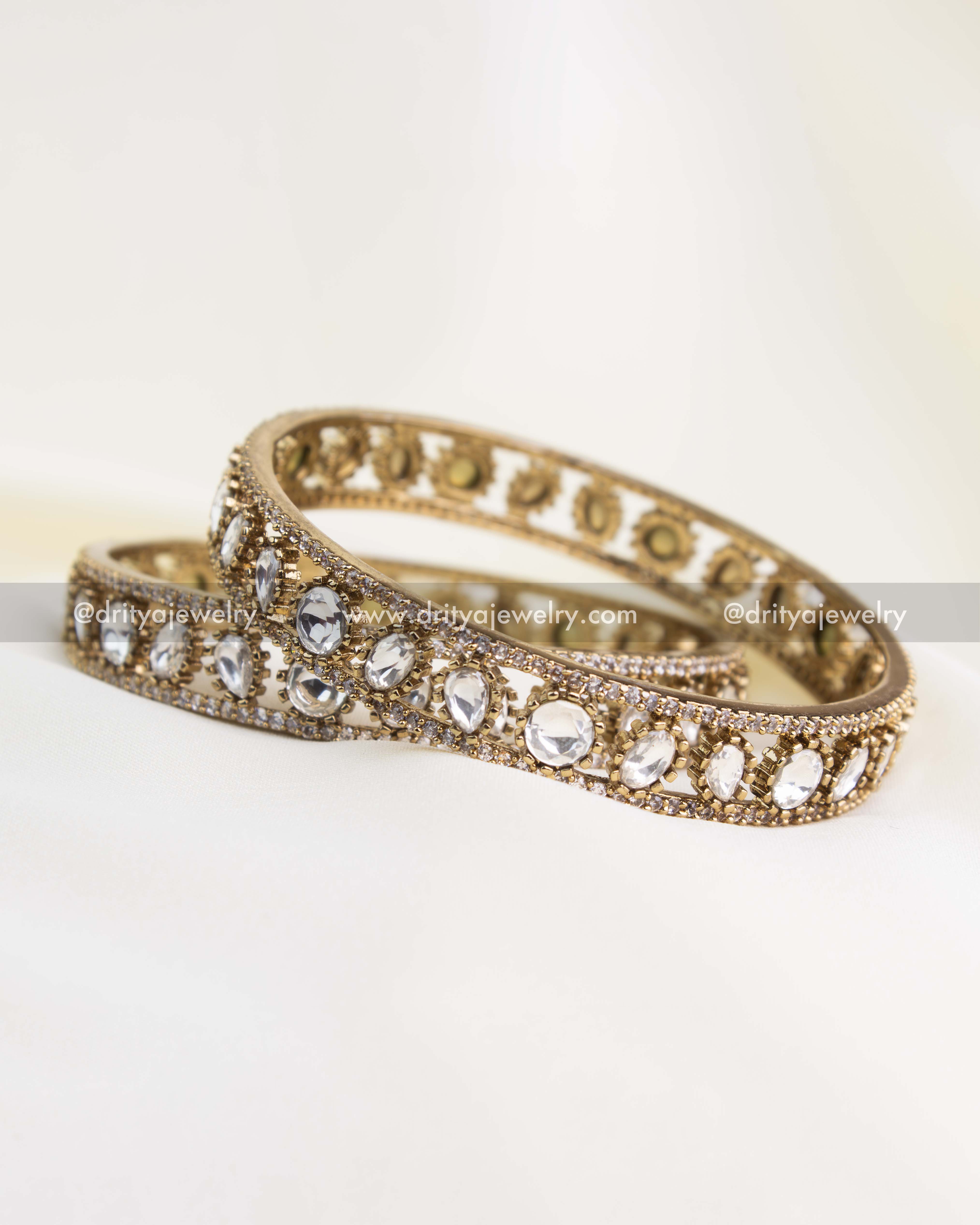 Pair of antique gold Polki Kundan bangles with uncut Moissanite-look stones.