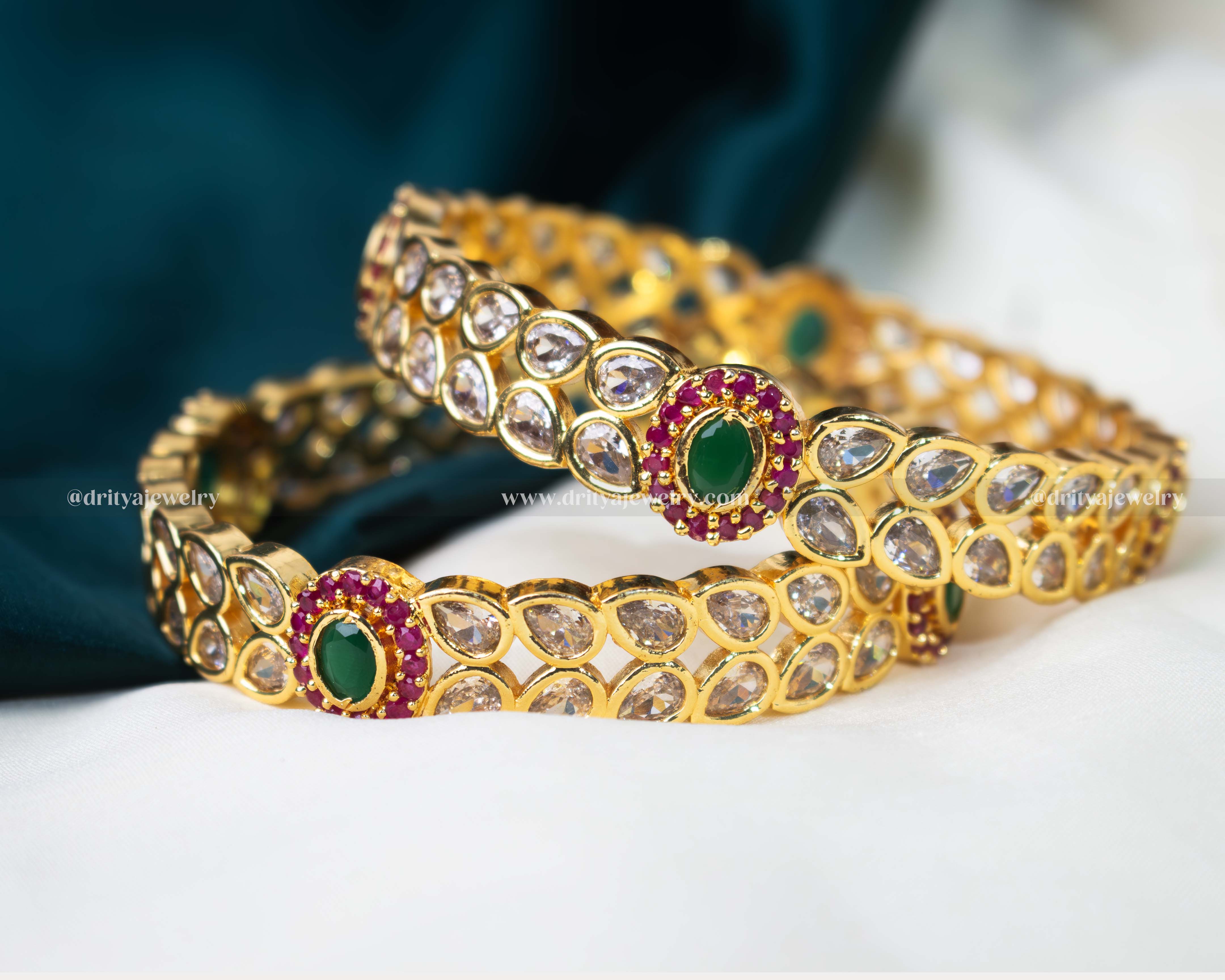 Opulent gold-plated bangle set with reverse-set CZ stones and colorful accents, perfect for weddings and formal events.