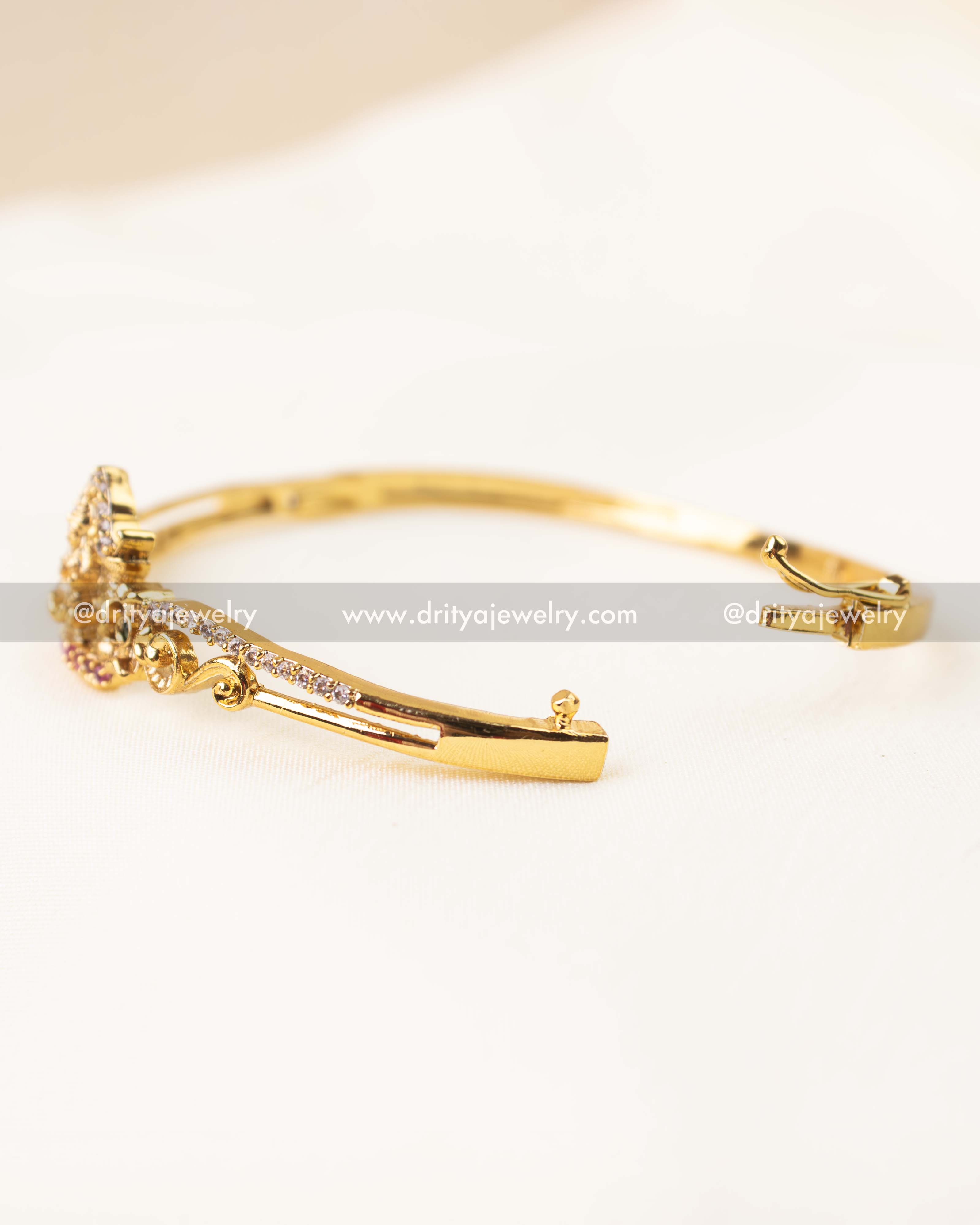 Openable temple kada with center Lakshmi design and secure clasp.