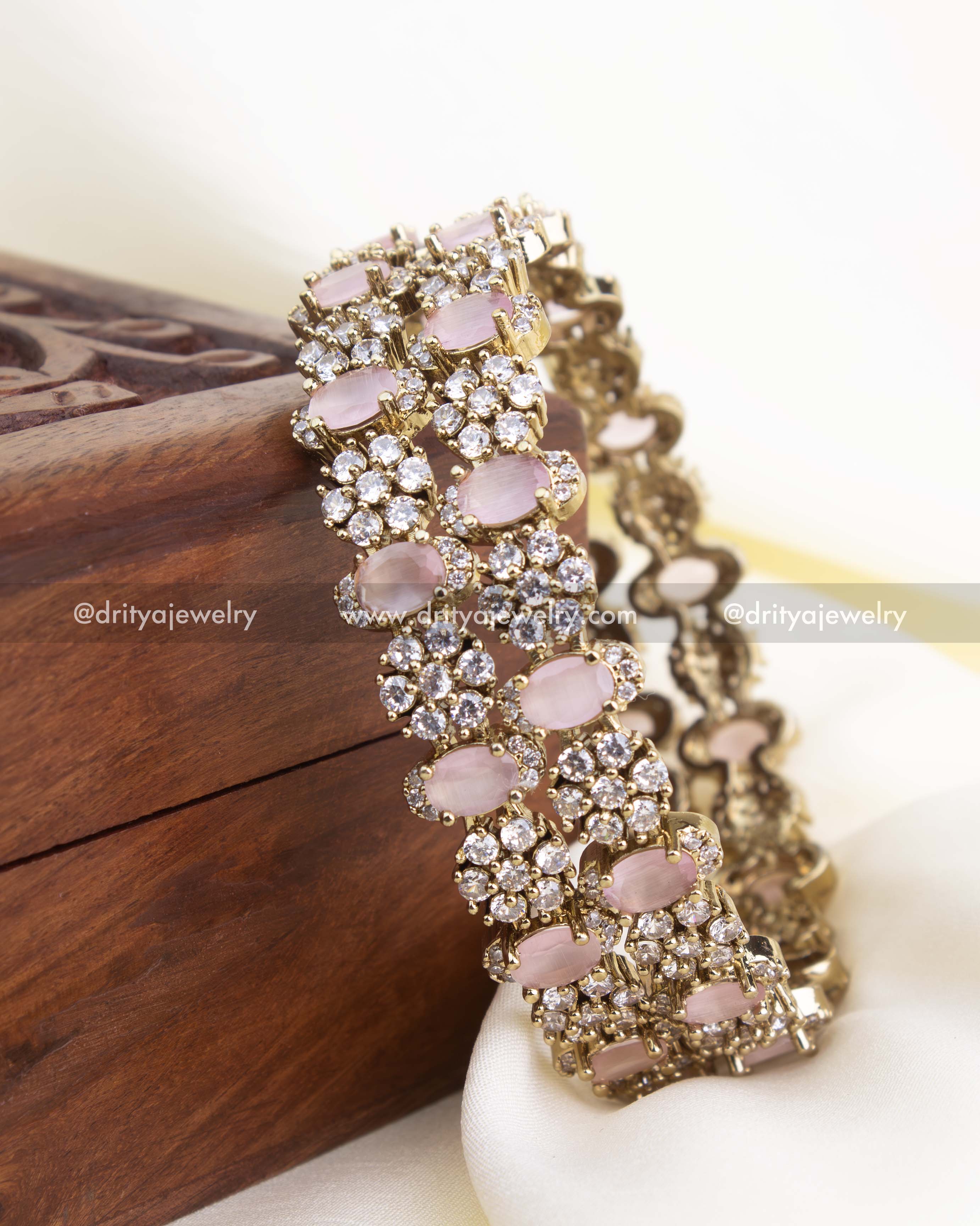 Antique gold Victorian bangles with blush pink oval stones and CZ cluster detailing.