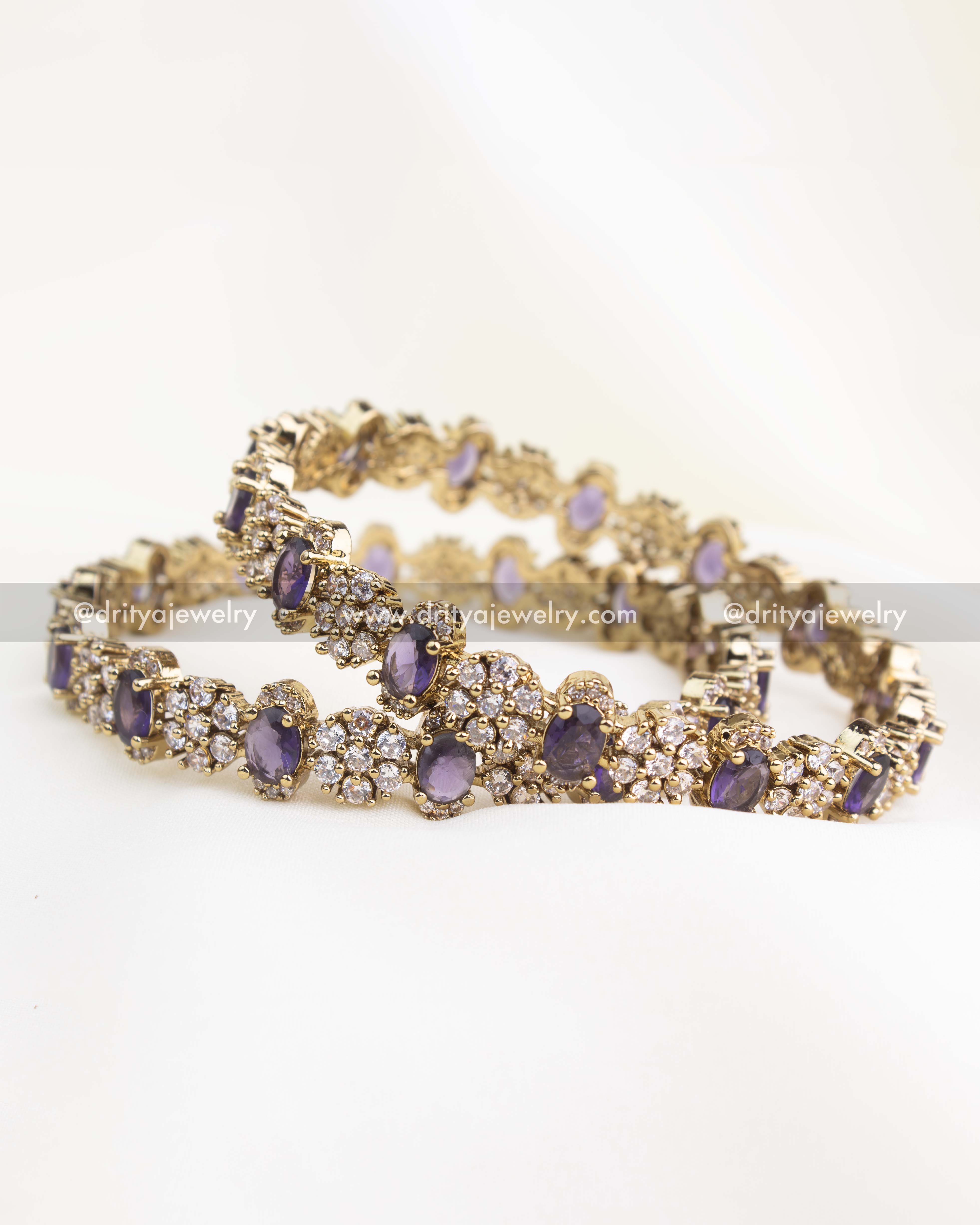 Antique gold Victorian bangle set with purple stones and white CZ detailing.