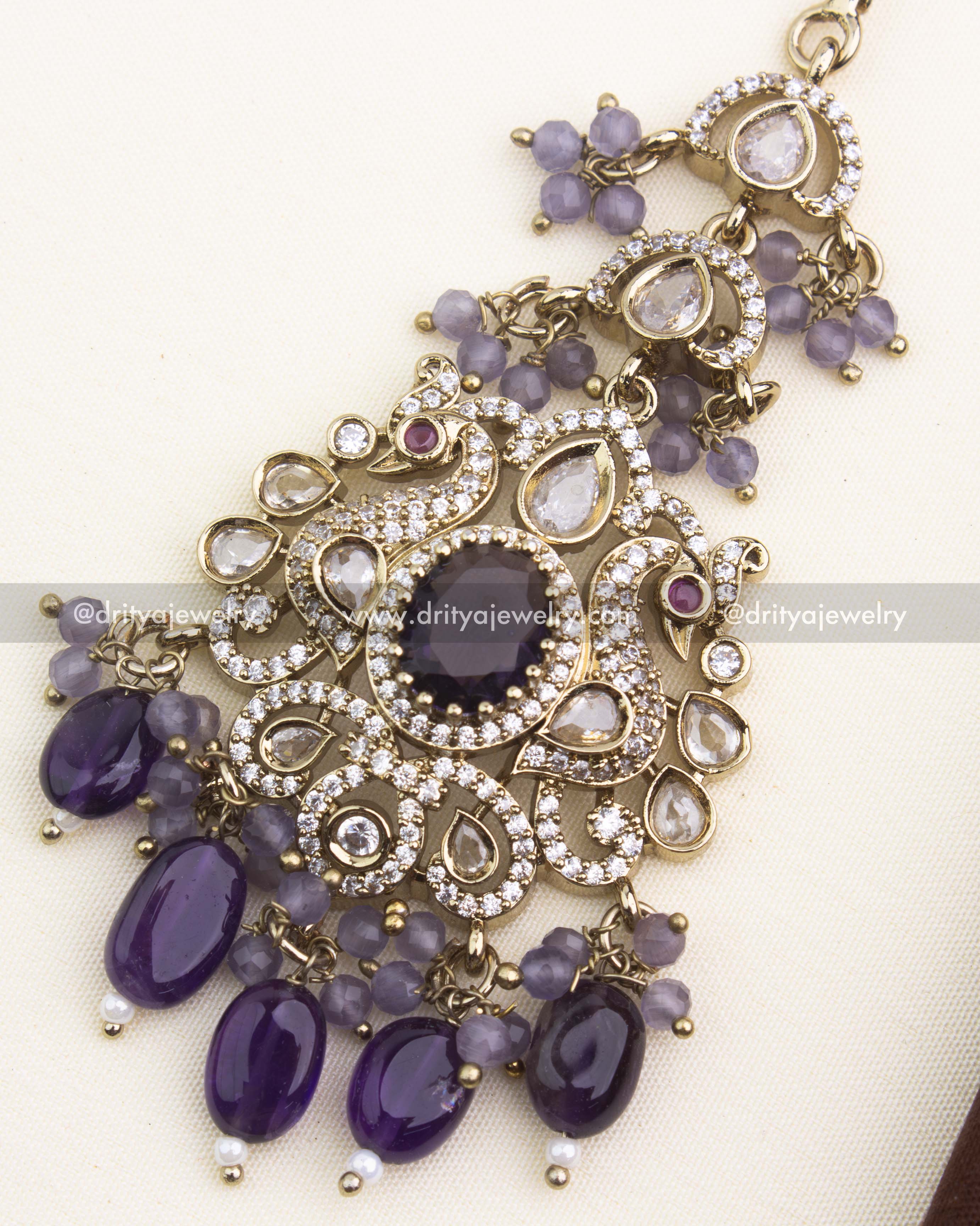 Close-up highlighting purple centerpiece, kundan polki stones, and antique Victorian detailing