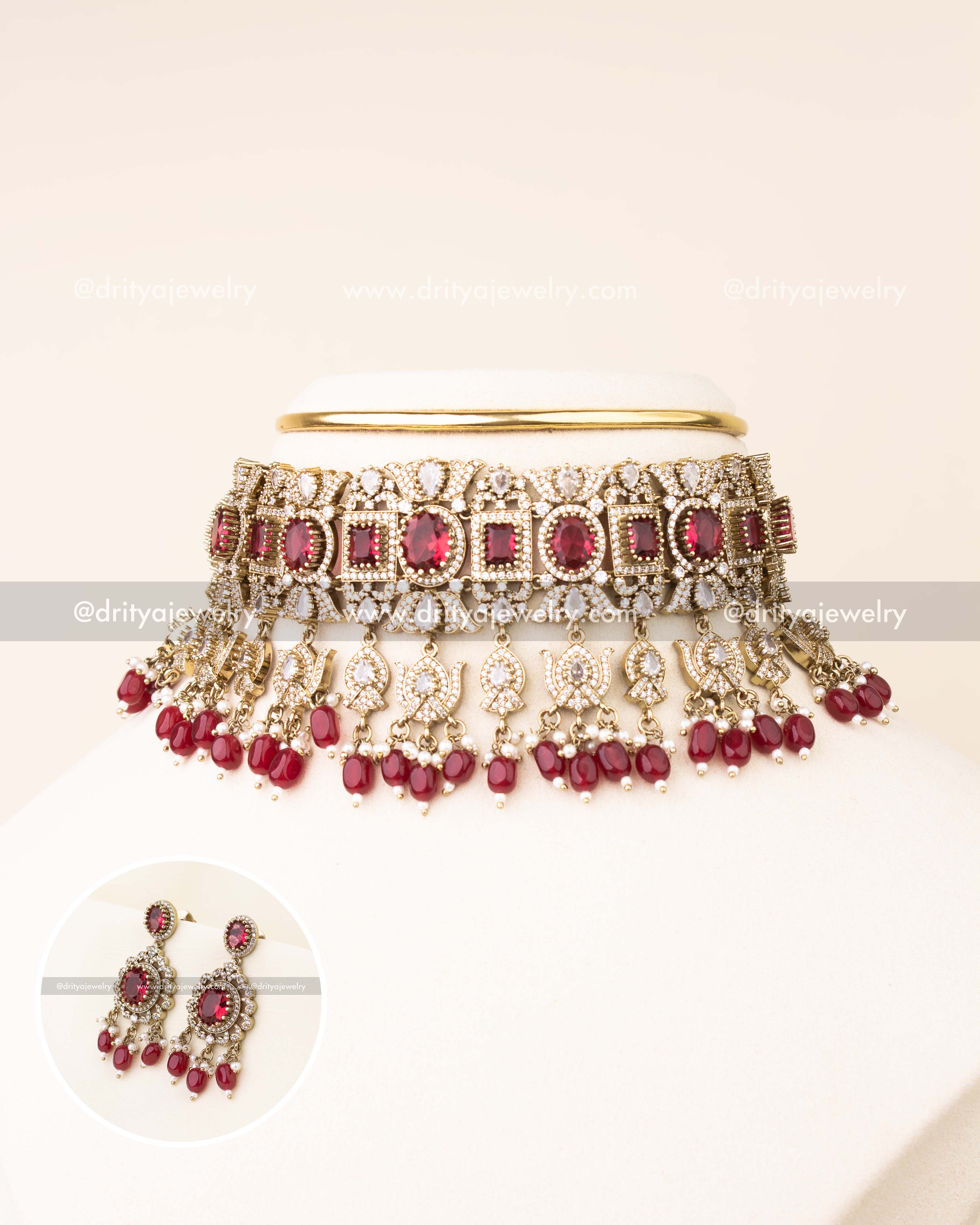 Luxurious ruby red bridal choker with AD stones and matching earrings.