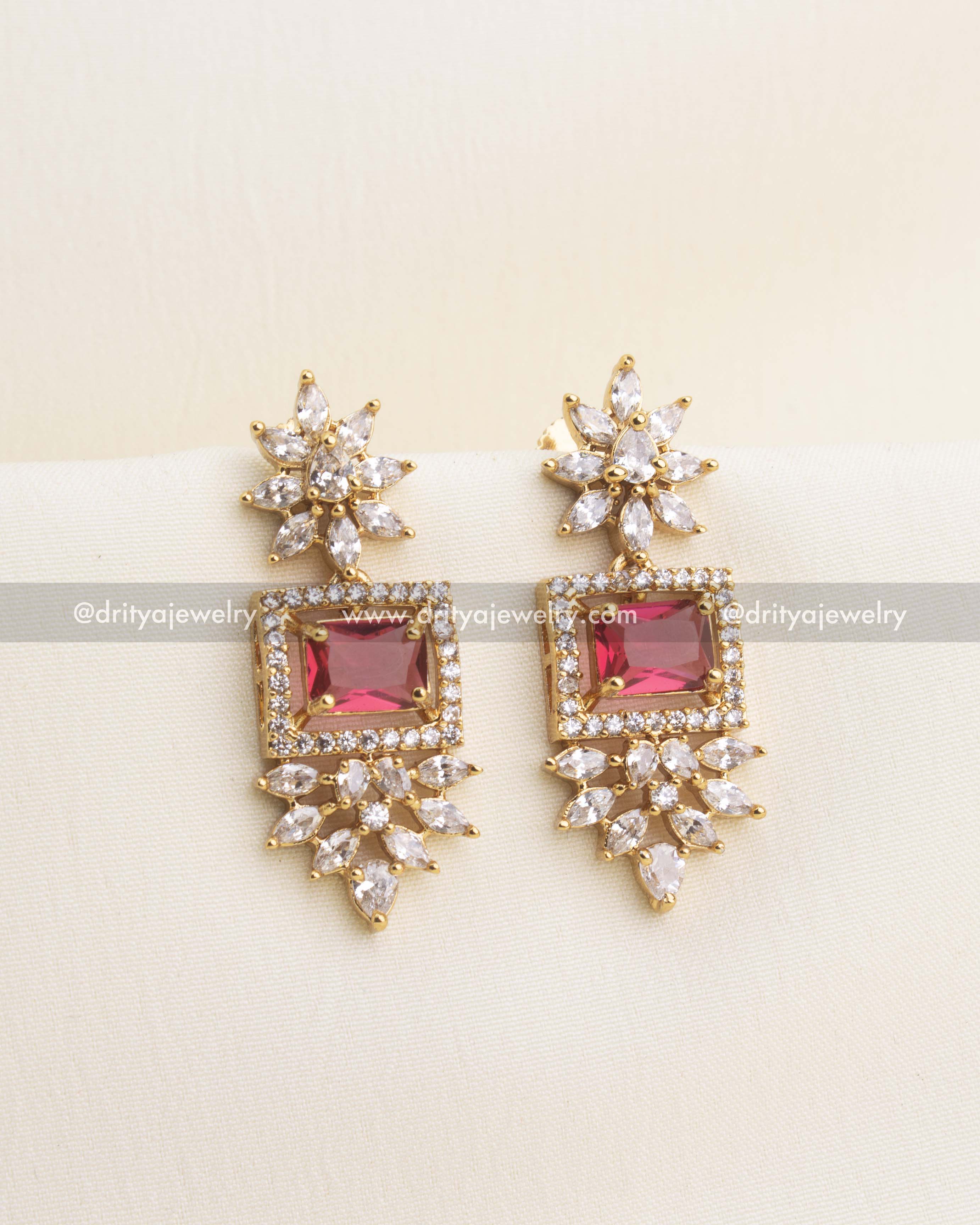 Elegant earrings with ruby red square stone and floral CZ drops.