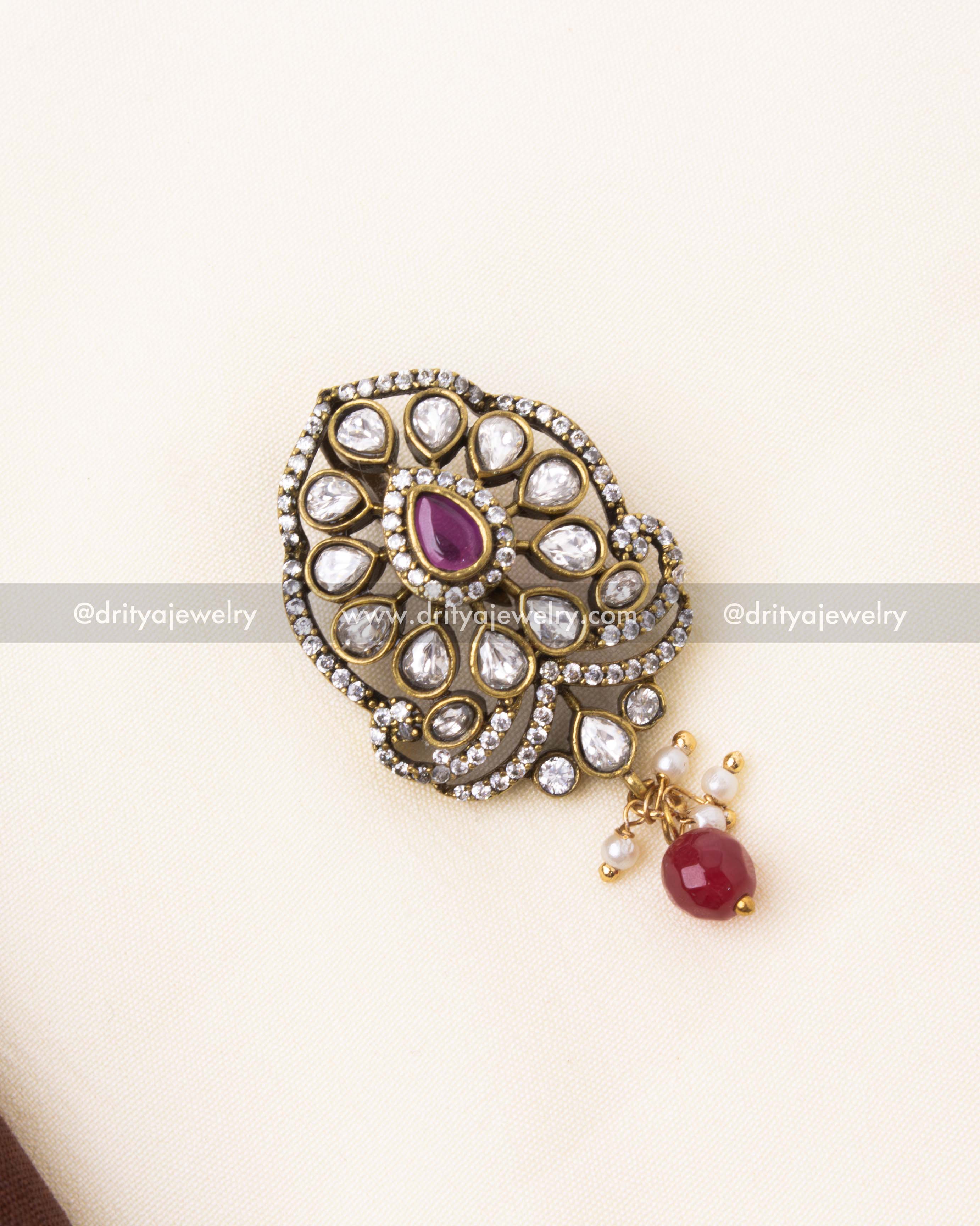 Exquisite ruby red Polki pendant featuring floral-inspired design and pearl accents.