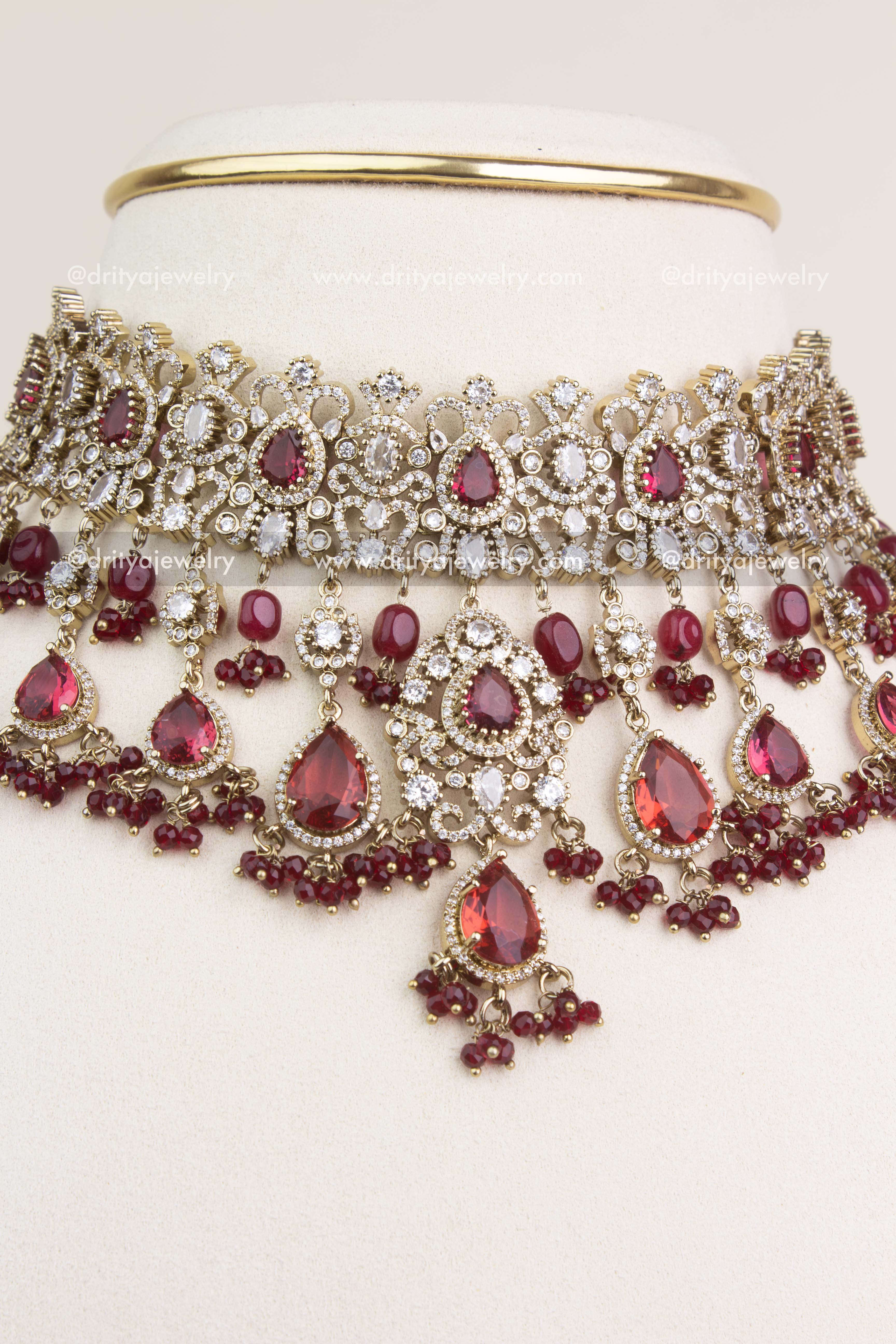 Elegant Ruby Red Victorian choker necklace with statement earrings for bridal wear.
