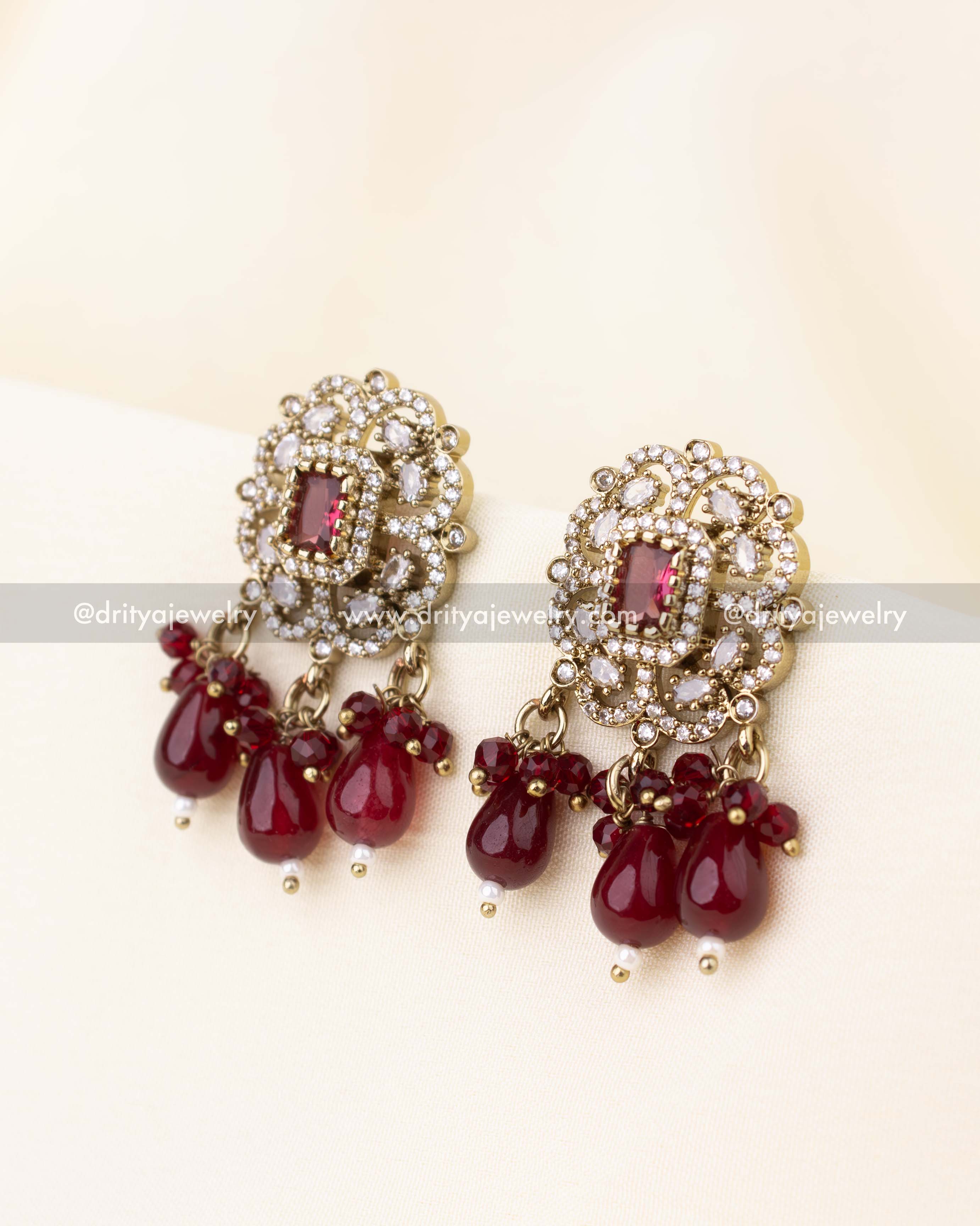 Victorian stud earrings with rich ruby red beads.