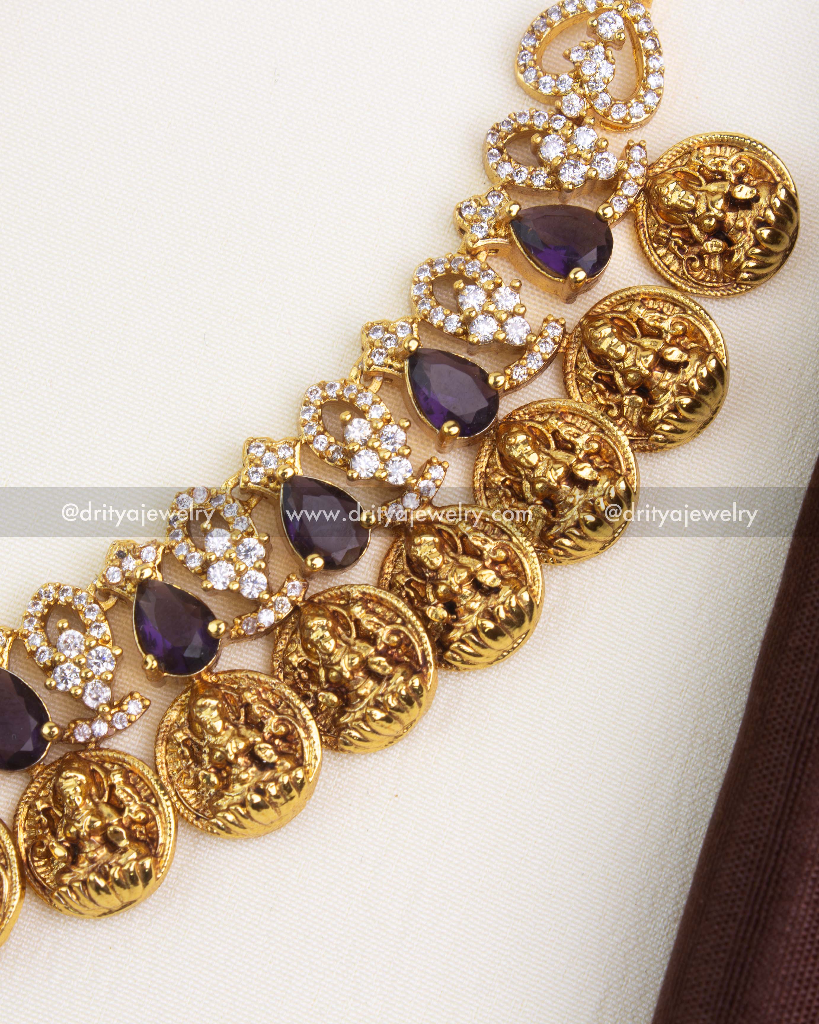 Alternating CZ vines and purple stones with handcrafted coin elements in temple jewelry style.