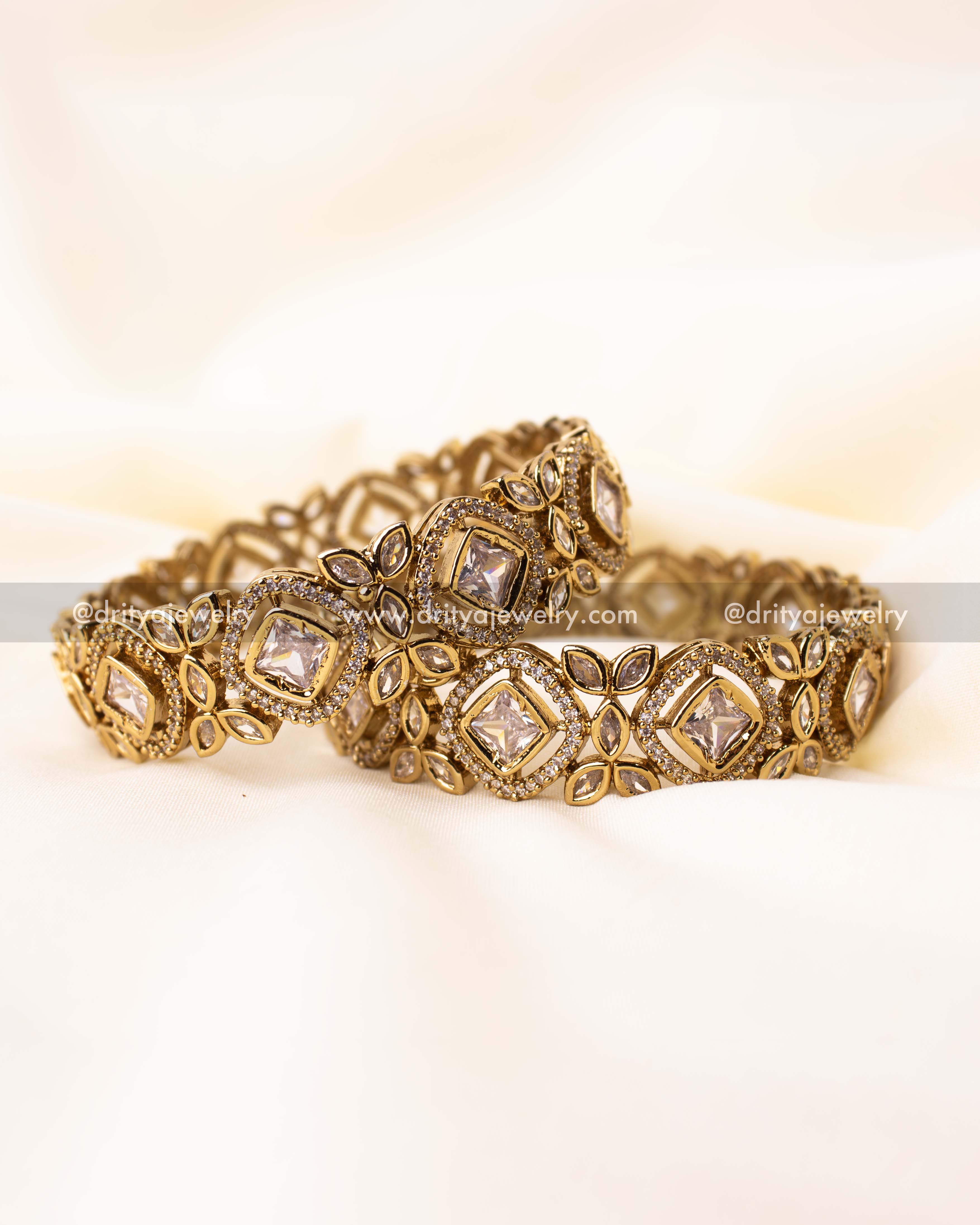 Detailed close-up showing floral and marquise motifs in antique finish Kundan bangles.