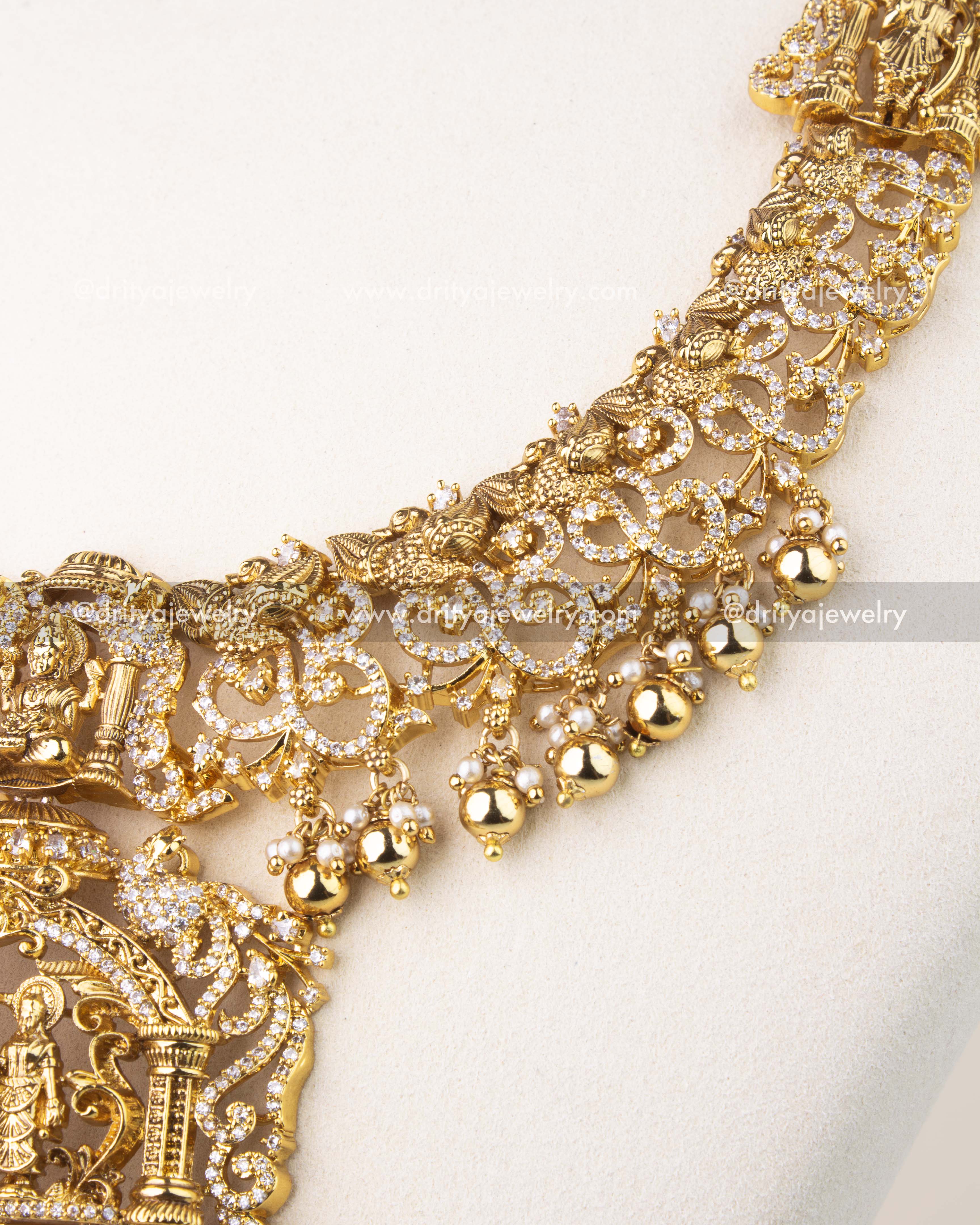 Exquisite Nakshi craftsmanship with peacock motifs, floral carvings, and CZ stone detailing.