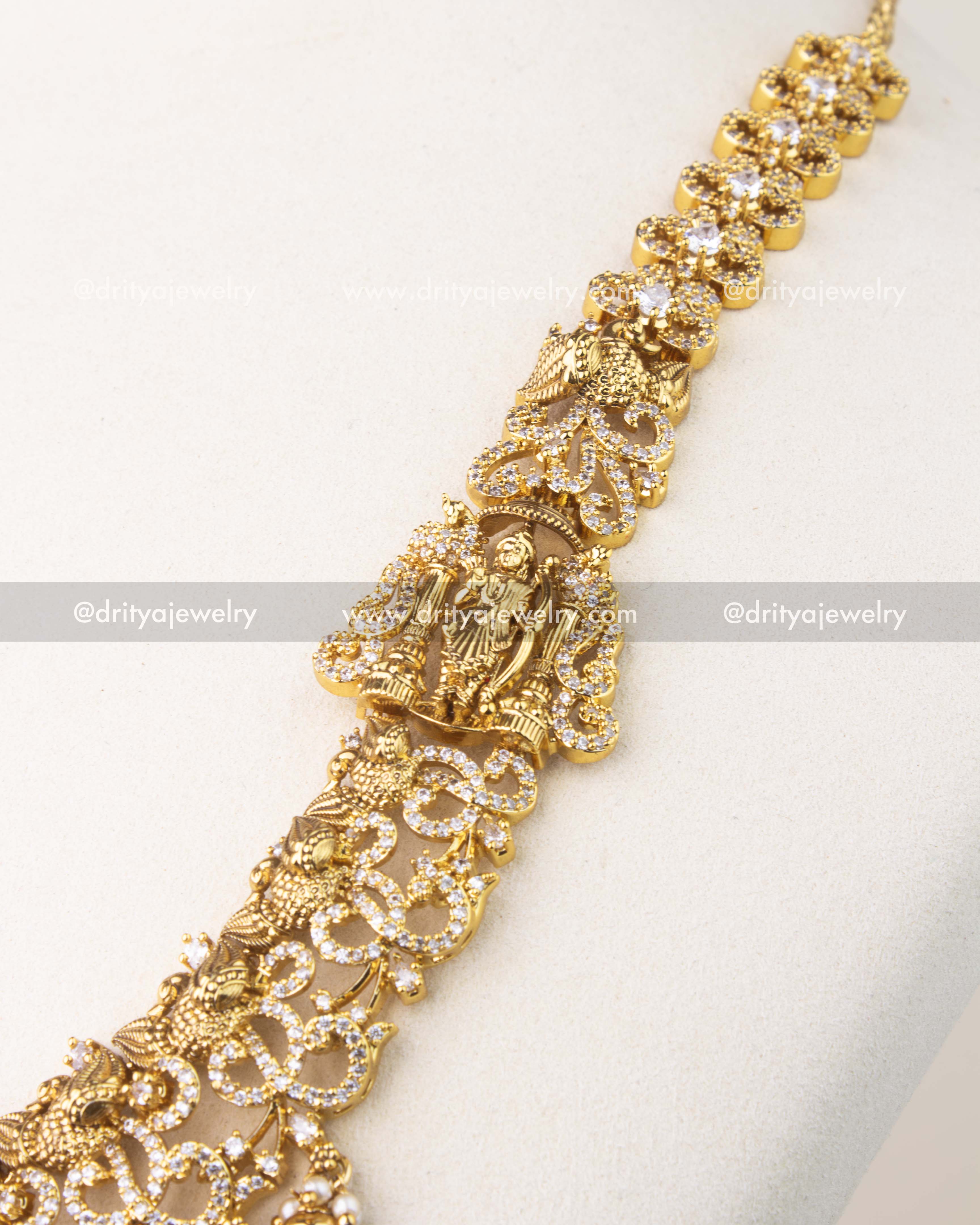 Exquisite Nakshi craftsmanship with peacock motifs, floral carvings, and CZ stone detailing.