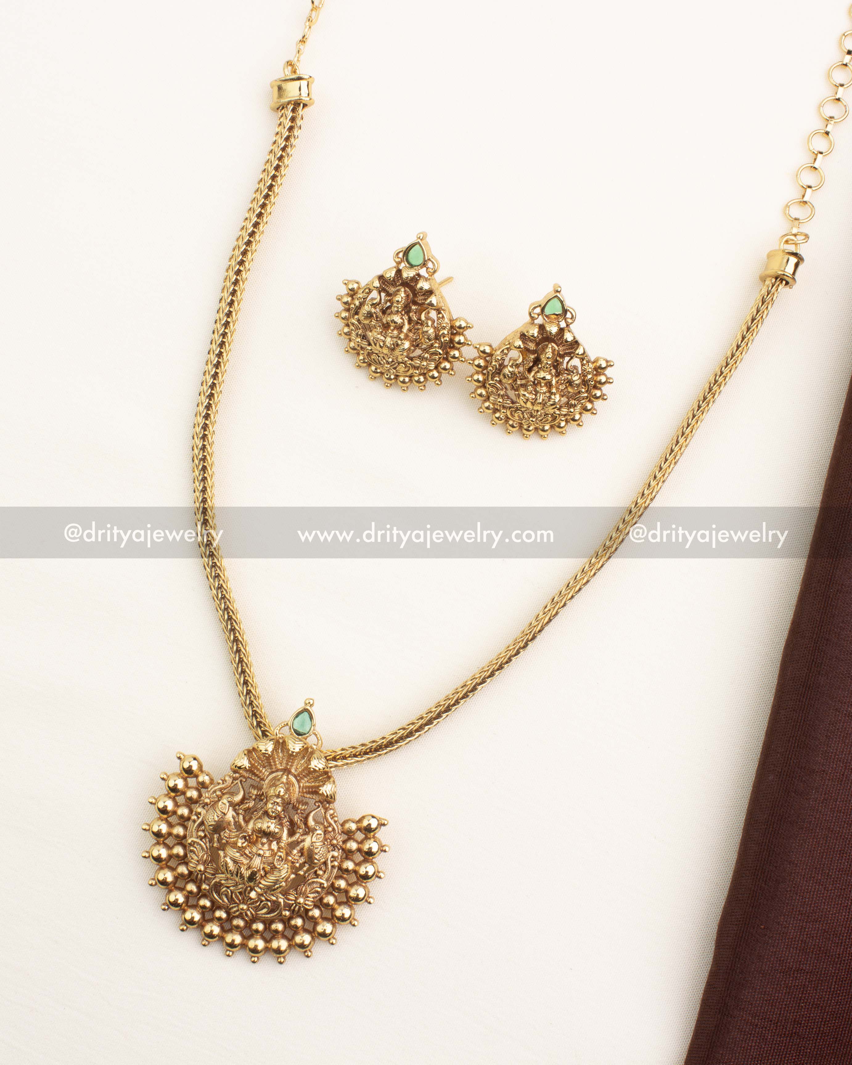 Antique gold short necklace with Lakshmi pendant and matching studs from Dritya Jewelry.