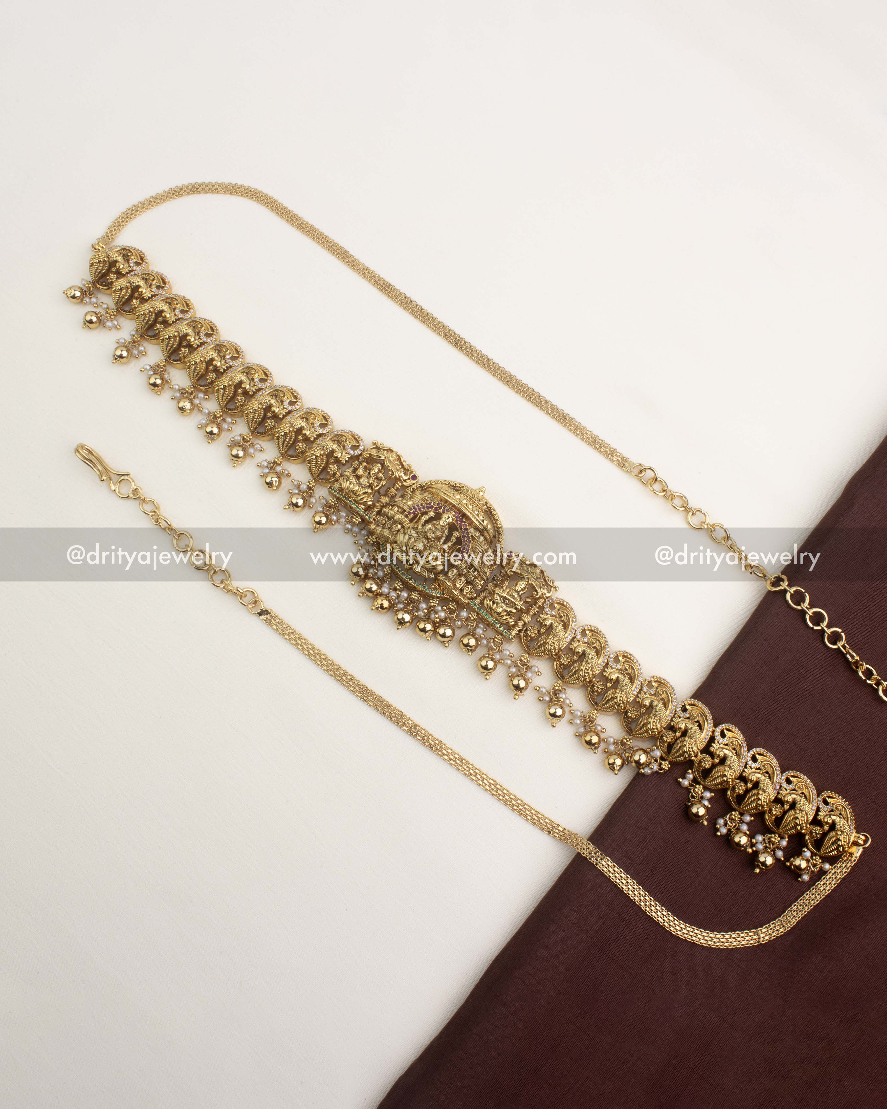 Antique temple waist belt with gold ball hangings and intricate nakshi peacock detailing.