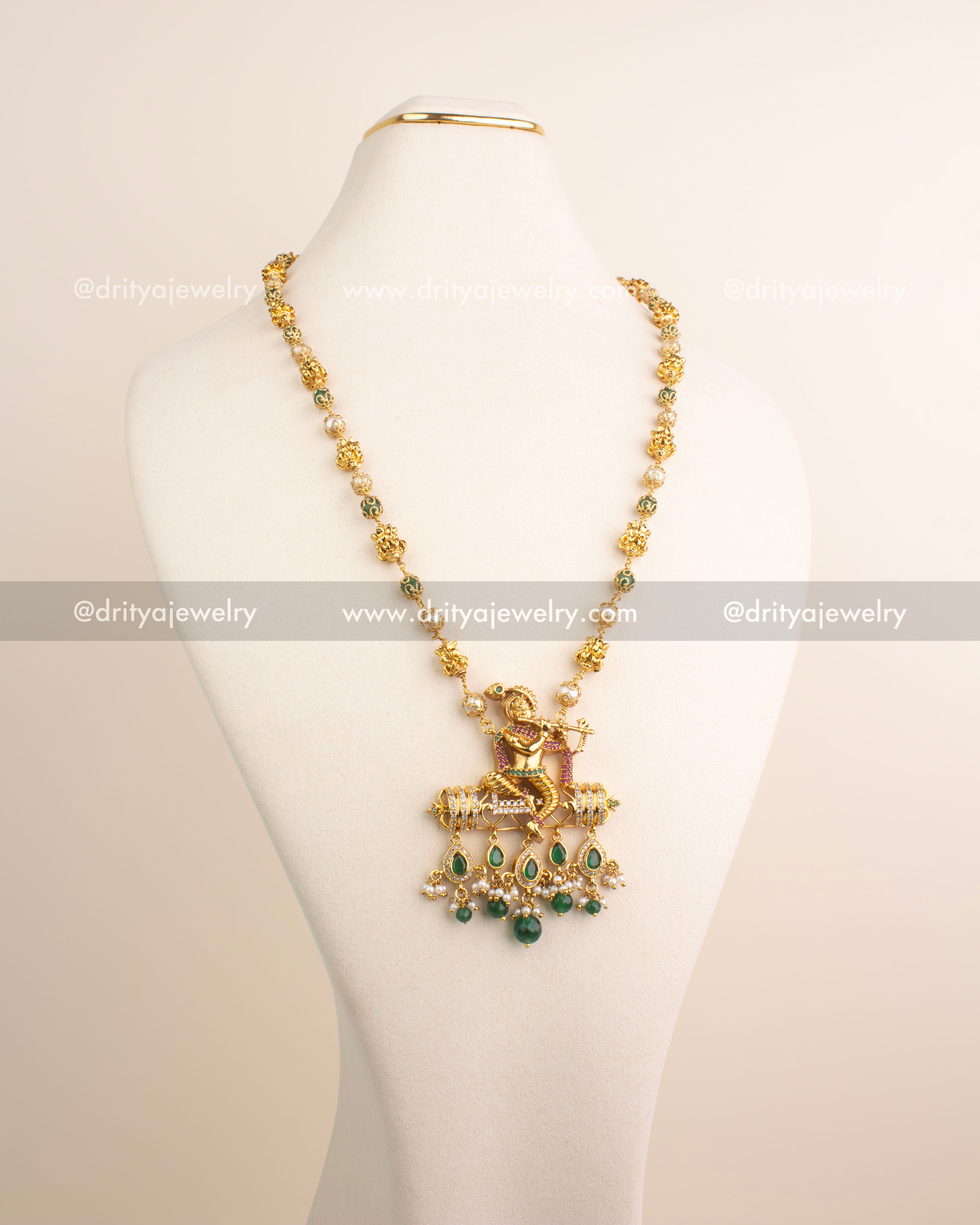 Premium temple jewelry necklace with Lord Krishna pendant and green bead drops.