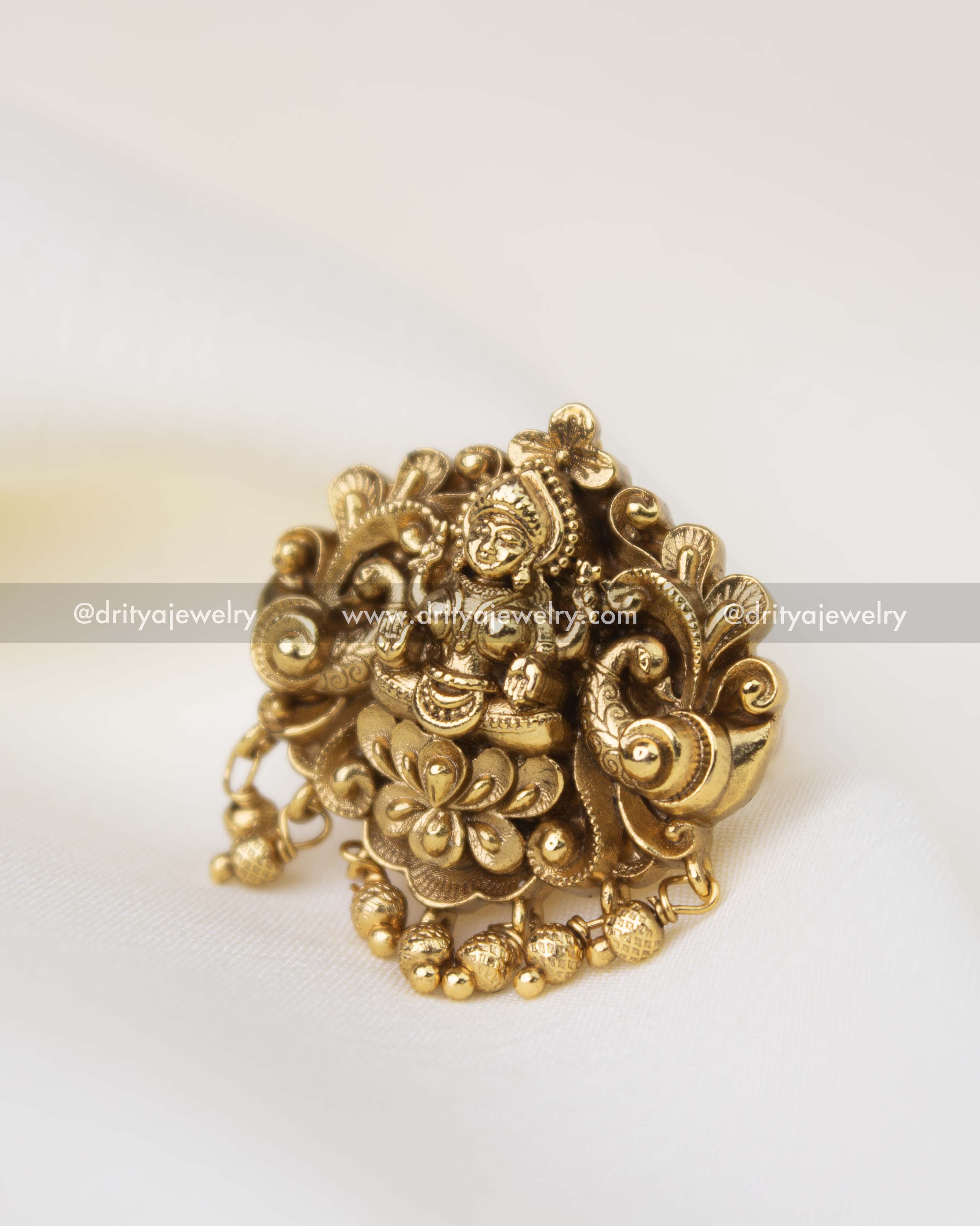 Traditional temple finger ring featuring goddess motif and decorative gold bead hangings