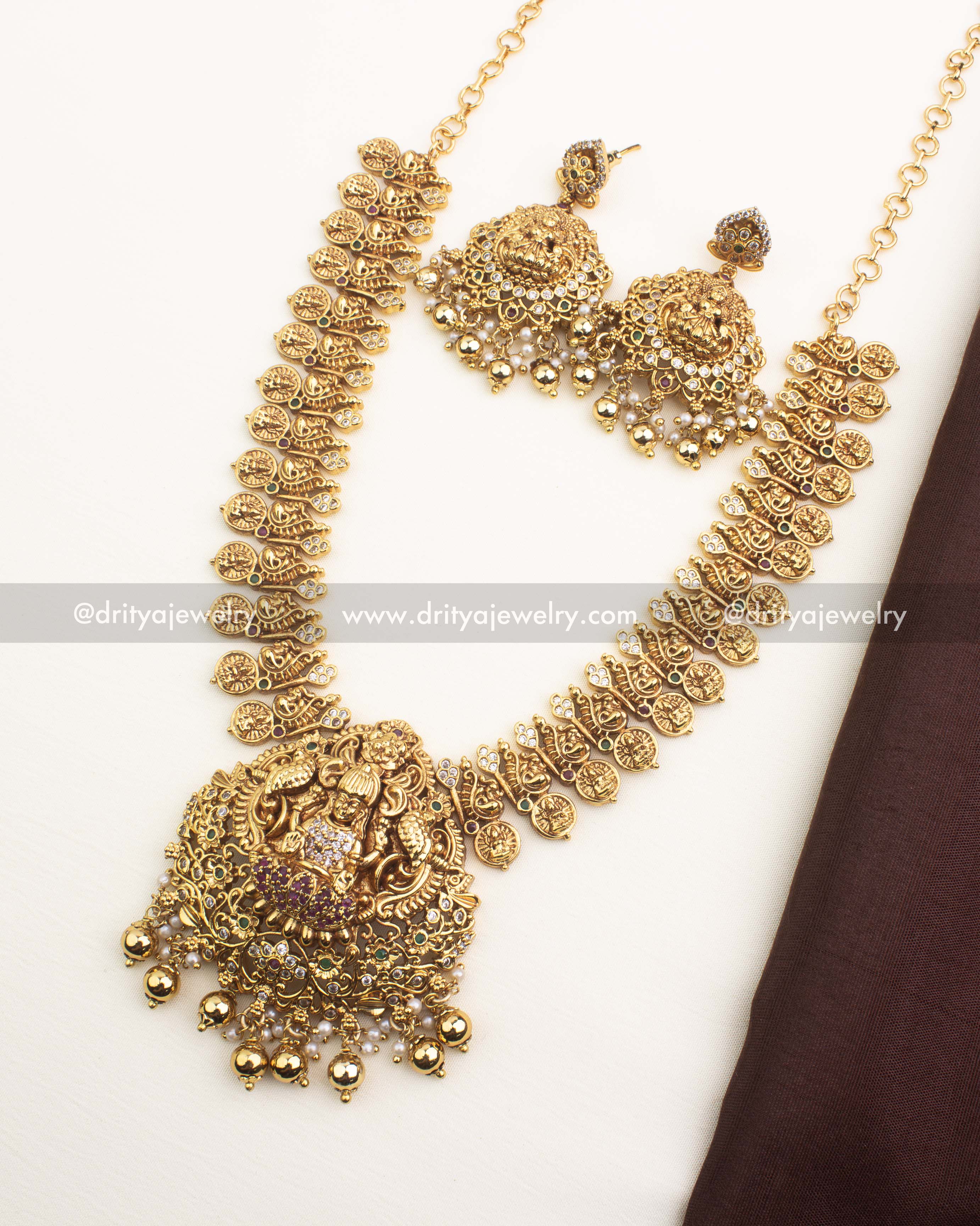 Premium temple short necklace with Lakshmi pendant, kasulu coins, and matching jhumka earrings.