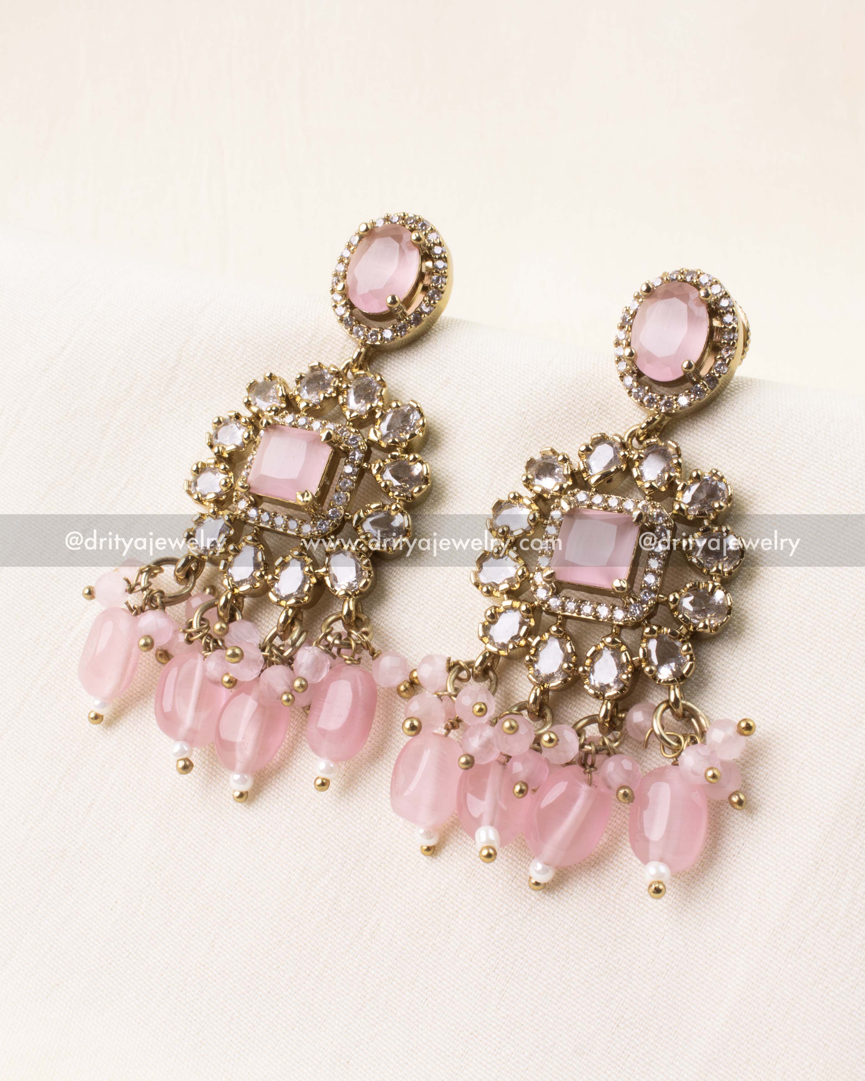 Earrings with blush pink stones and dangling beads matching the Victorian choker.