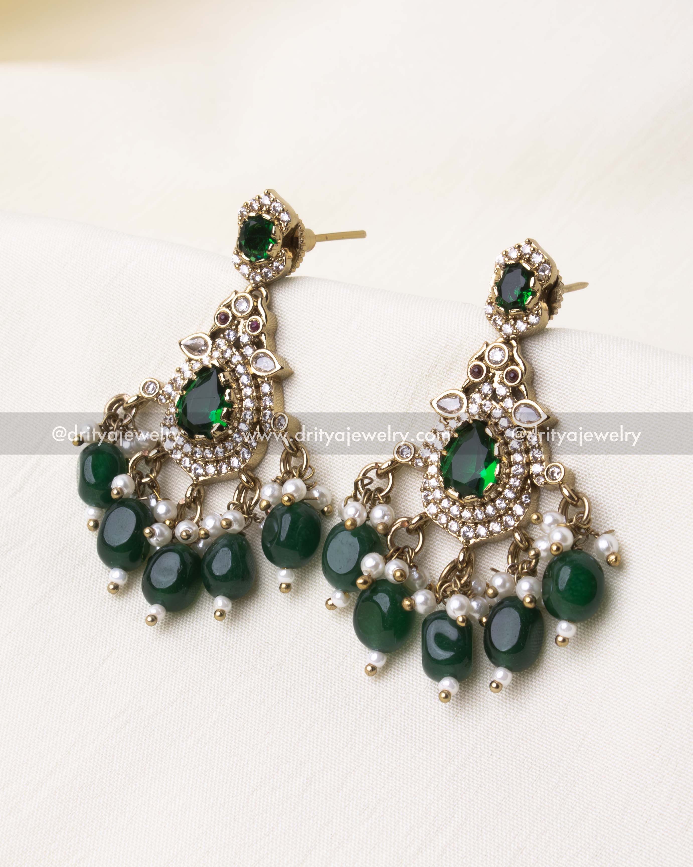 Matching Victorian choker earrings featuring green gemstones and pearl accents.