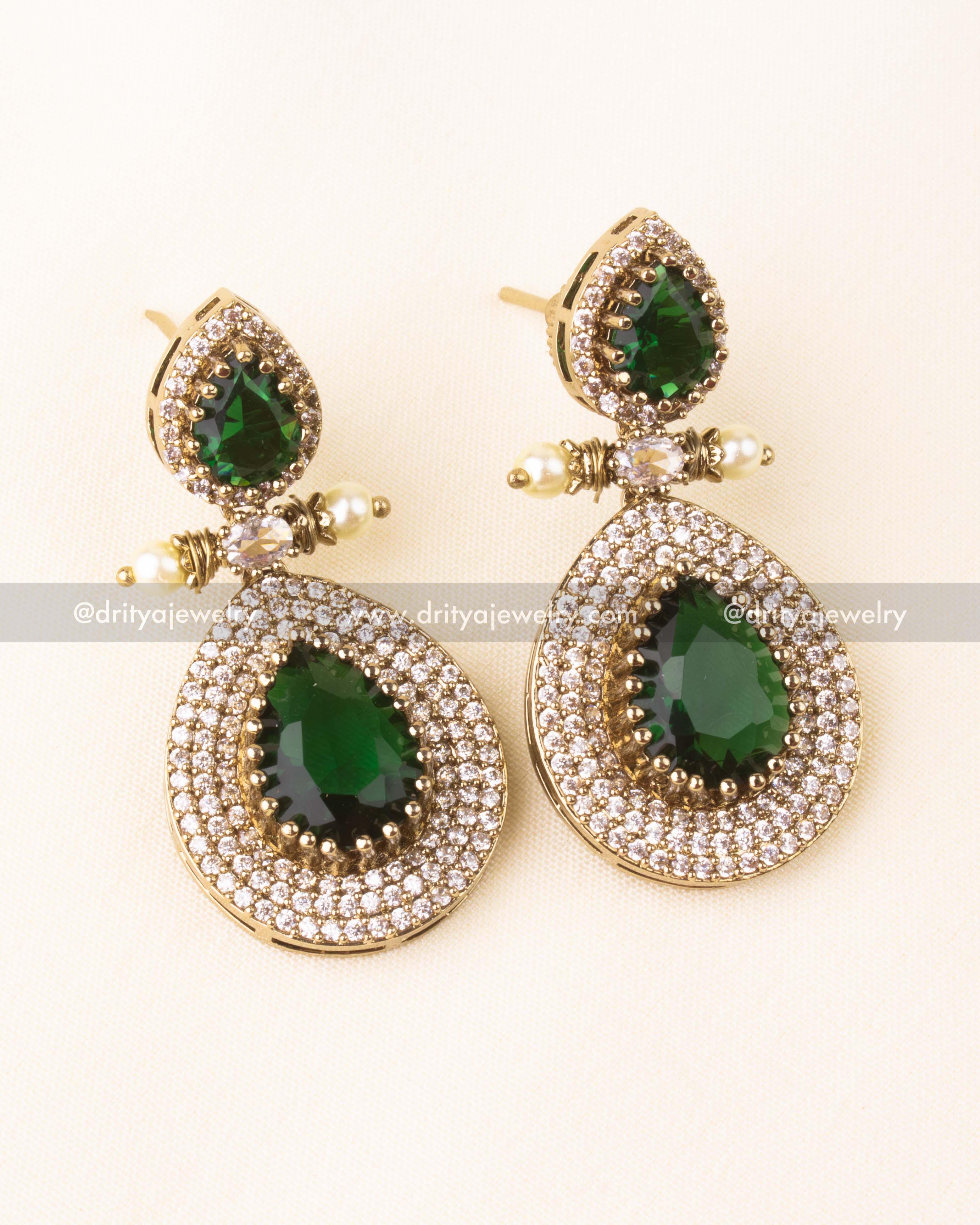 Premium Victorian layered short necklace with emerald-colored stones, zircon detailing, and pearl embellishments, paired with statement earrings.