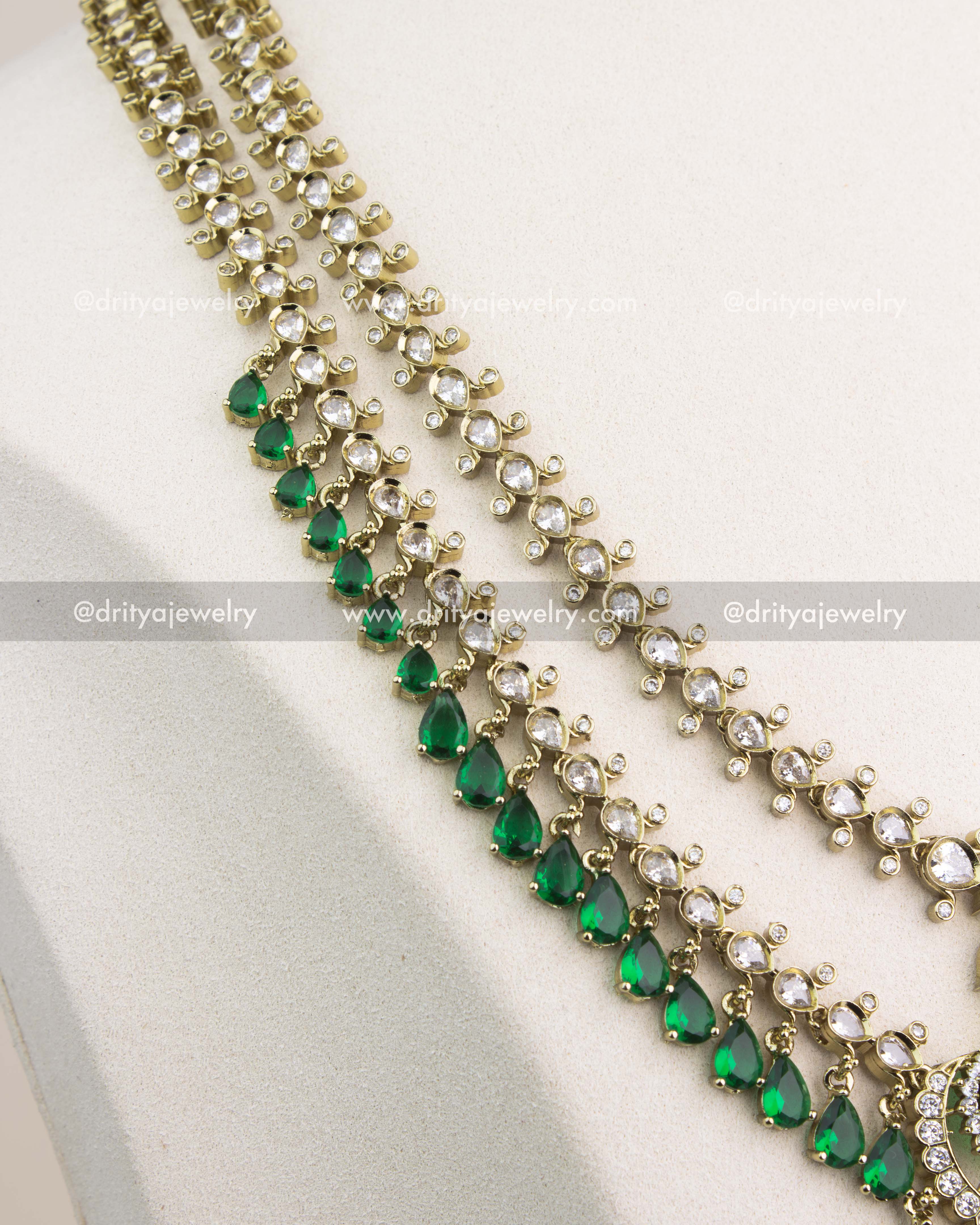 Close-up of 3-layer Victorian chain with alternating CZ and emerald green teardrop stones.