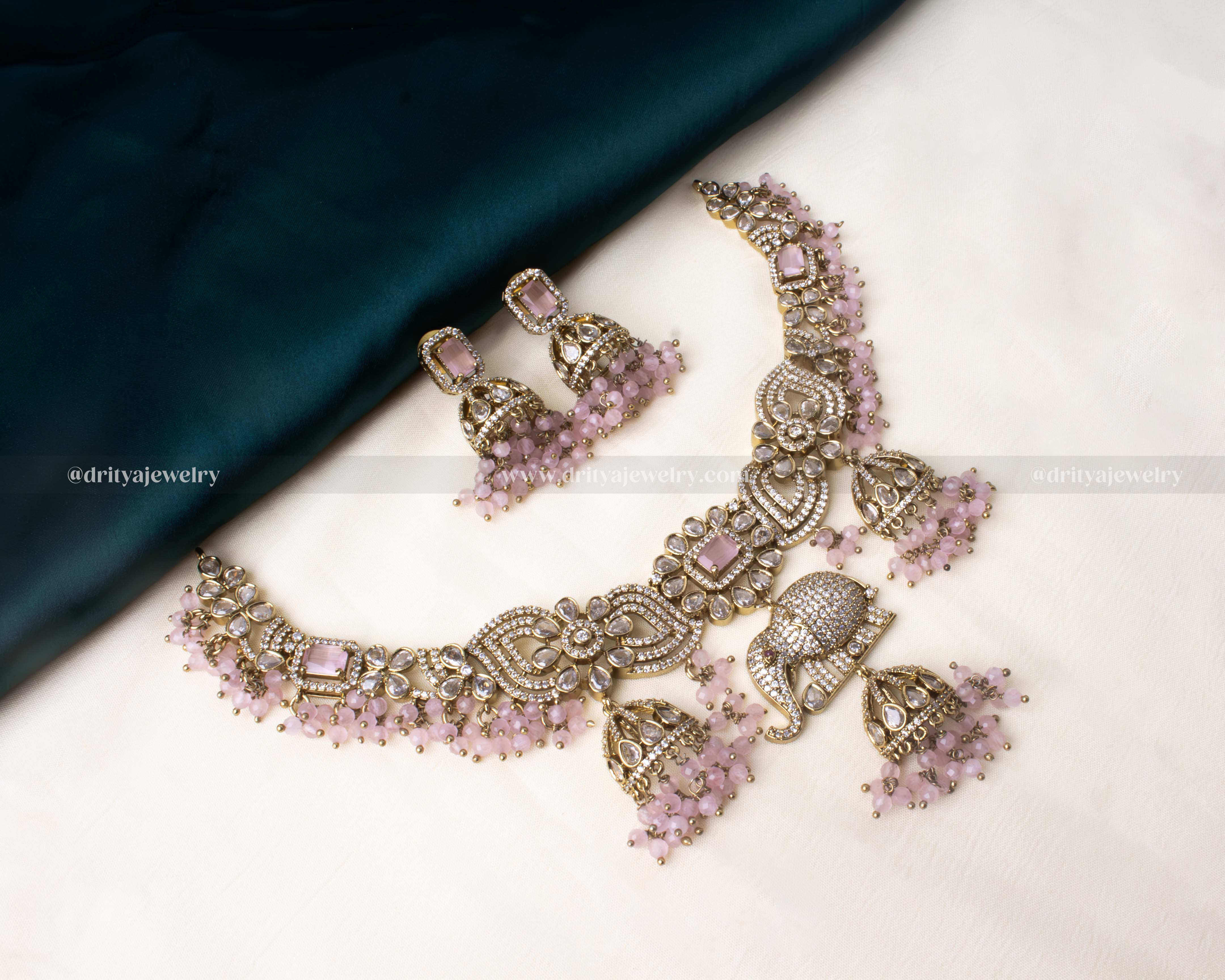 Premium Victorian necklace with an elephant centerpiece, adorned with CZ stones and blush pink accents.