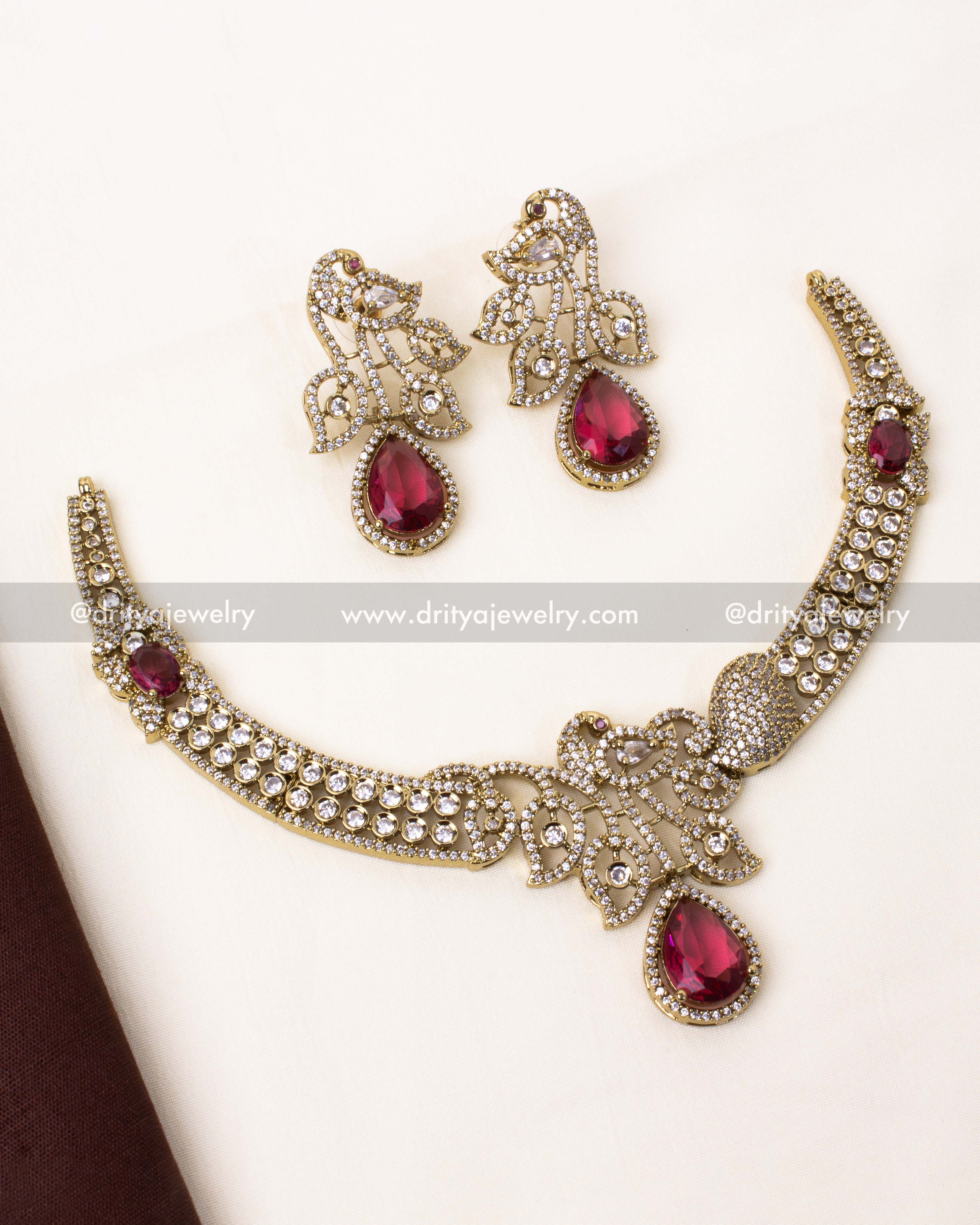 Elegant red Victorian peacock necklace with dazzling stones and matching earrings.