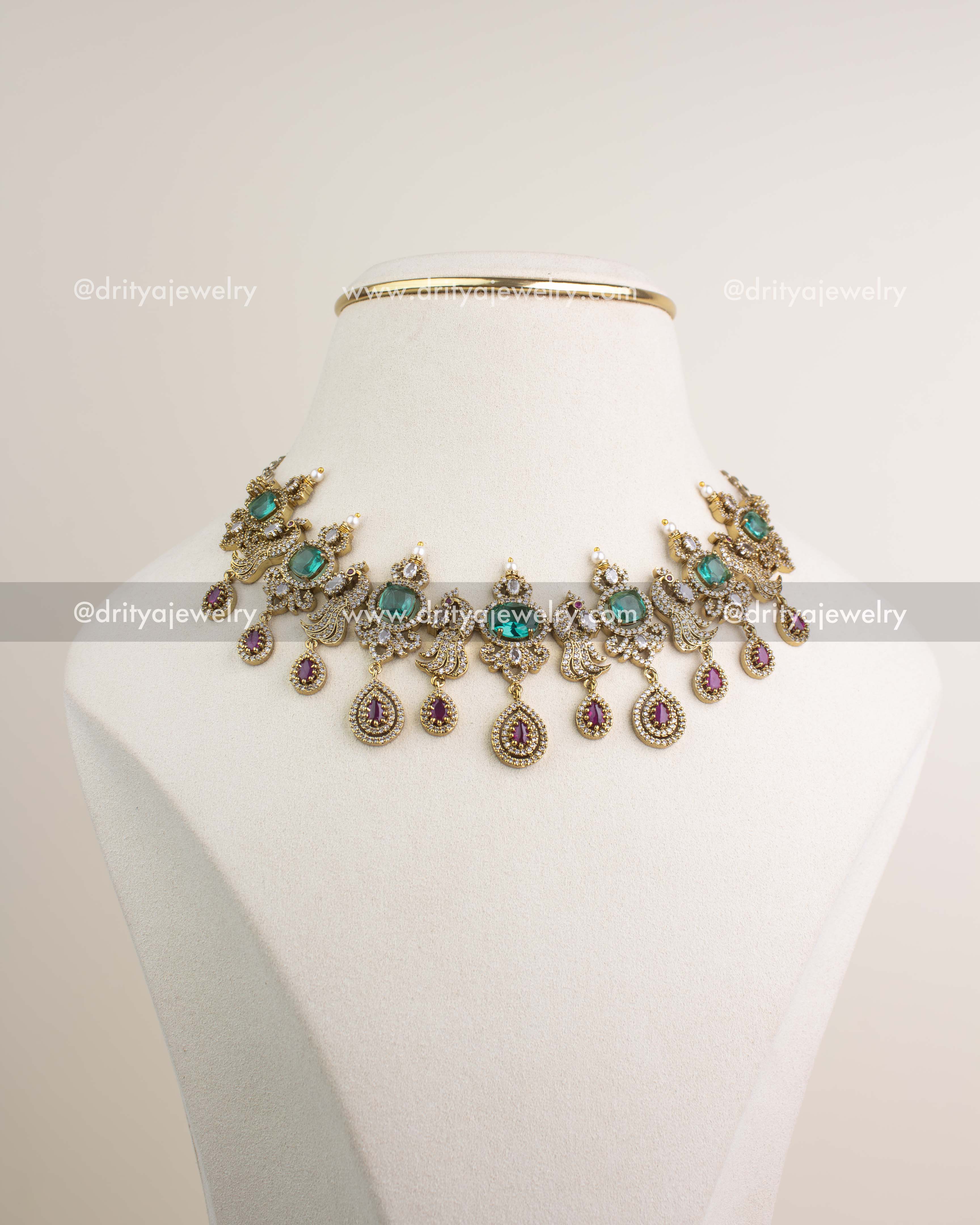Premium Victorian choker with Russian emerald stones, pearls, and CZ detailing inspired by celebrity Sneha.