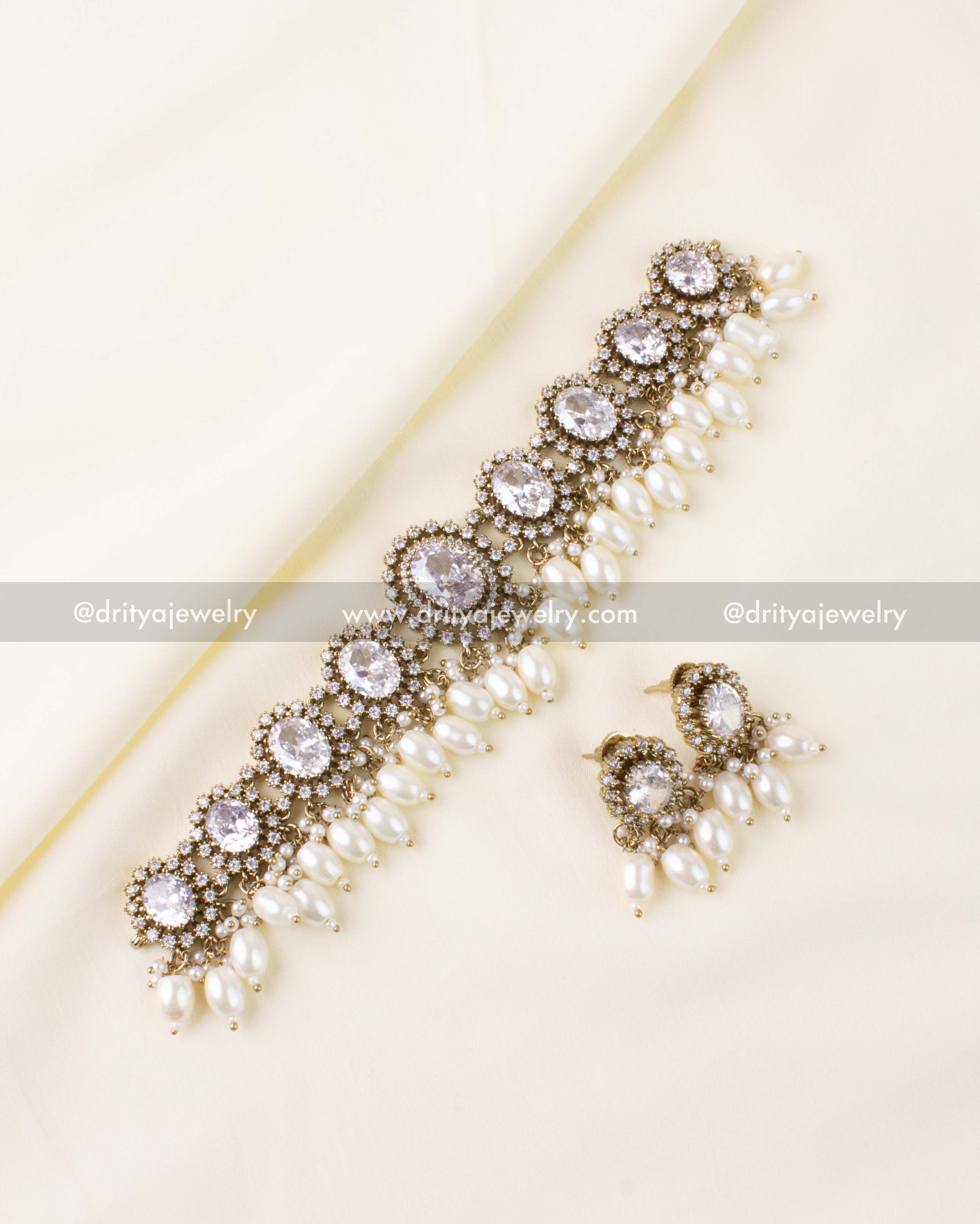 Victorian-style choker with white stones and pearl drops
