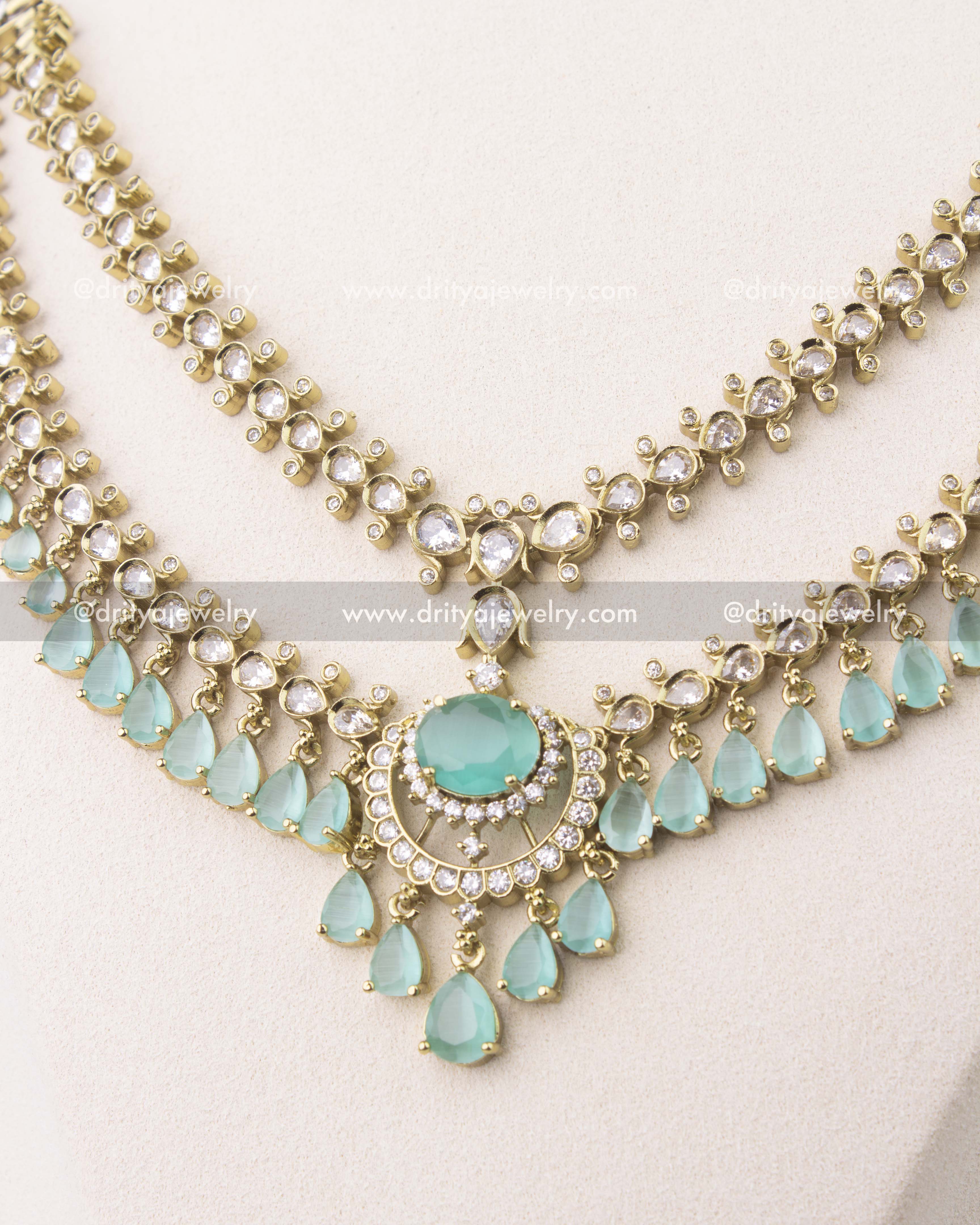 close up of Premium Victorian layered necklace set with mint green stones and gold finish