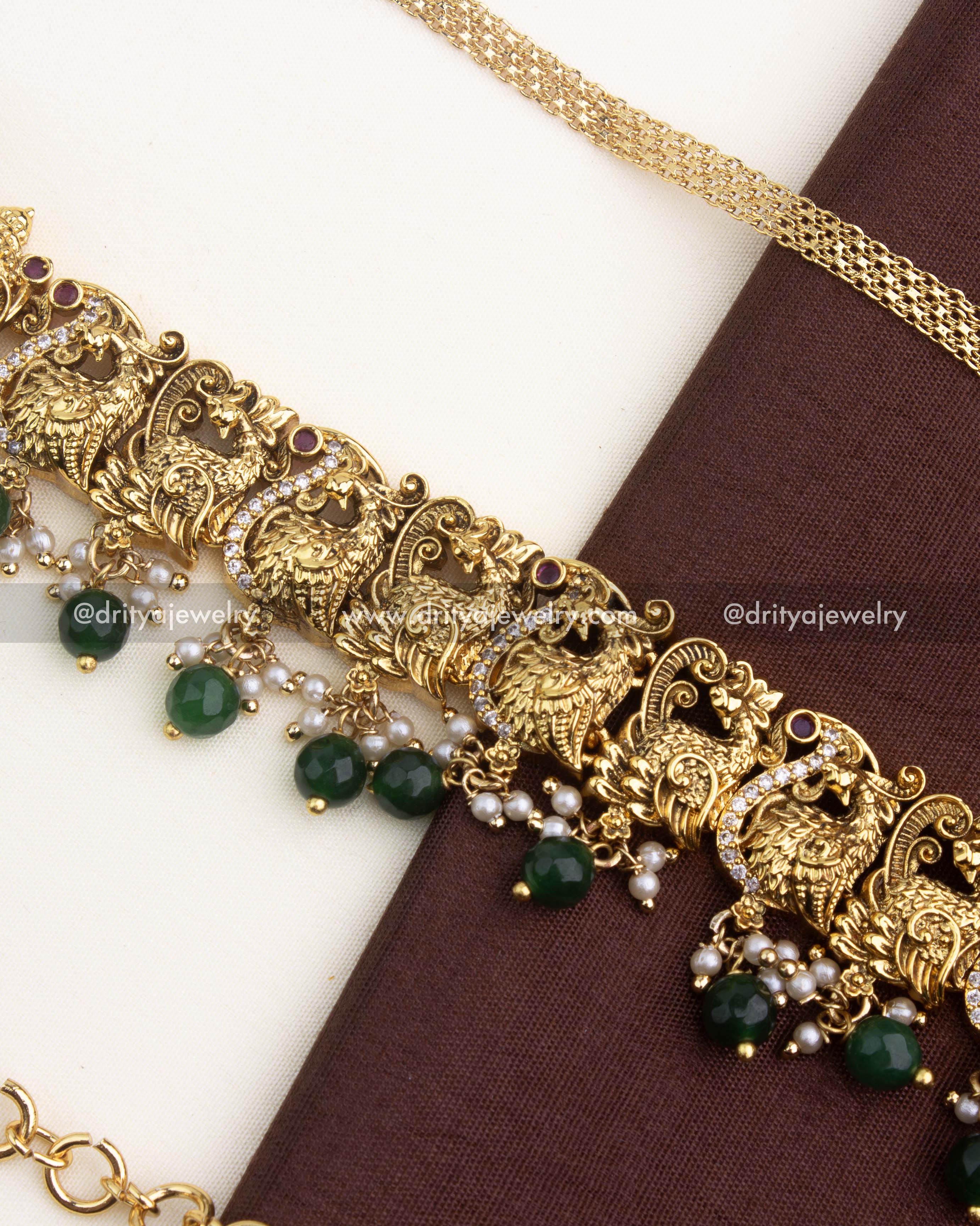 Adjustable temple hip chain with antique gold-plated layered chain detailing.