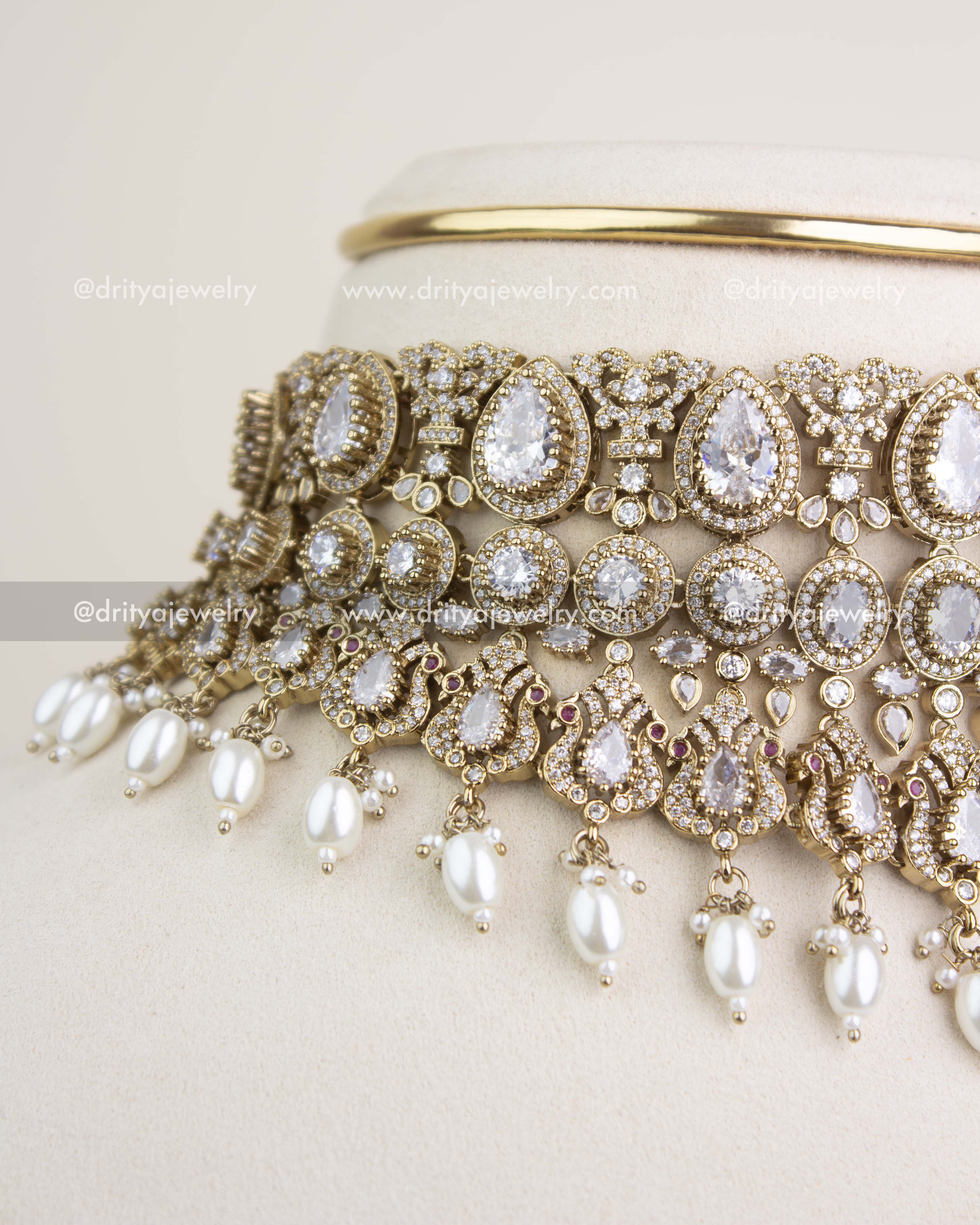 Close-up view of Russian emerald stones, teardrop motifs, and intricate Victorian filigree craftsmanship.