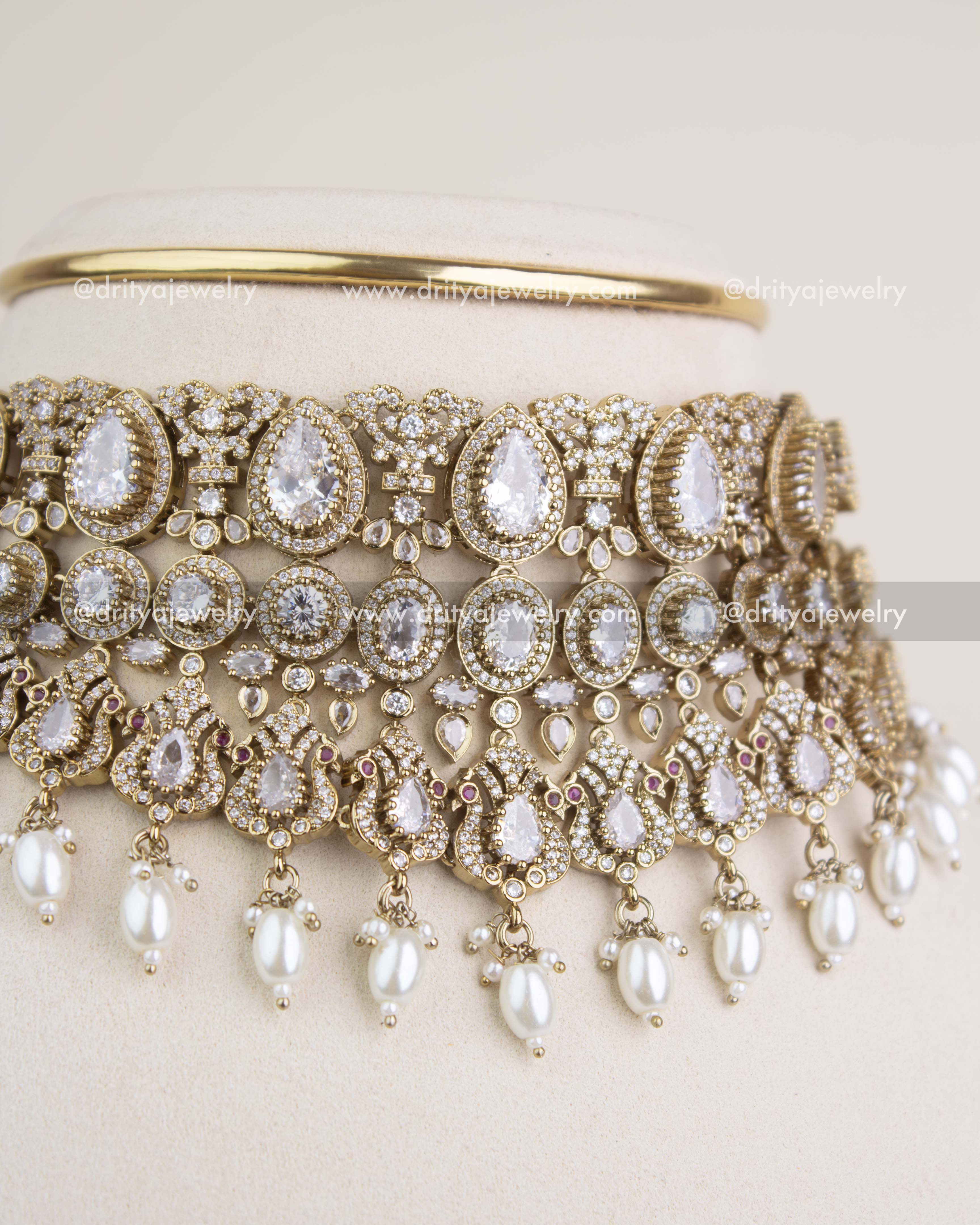 Close-up view of Russian emerald stones, teardrop motifs, and intricate Victorian filigree craftsmanship.
